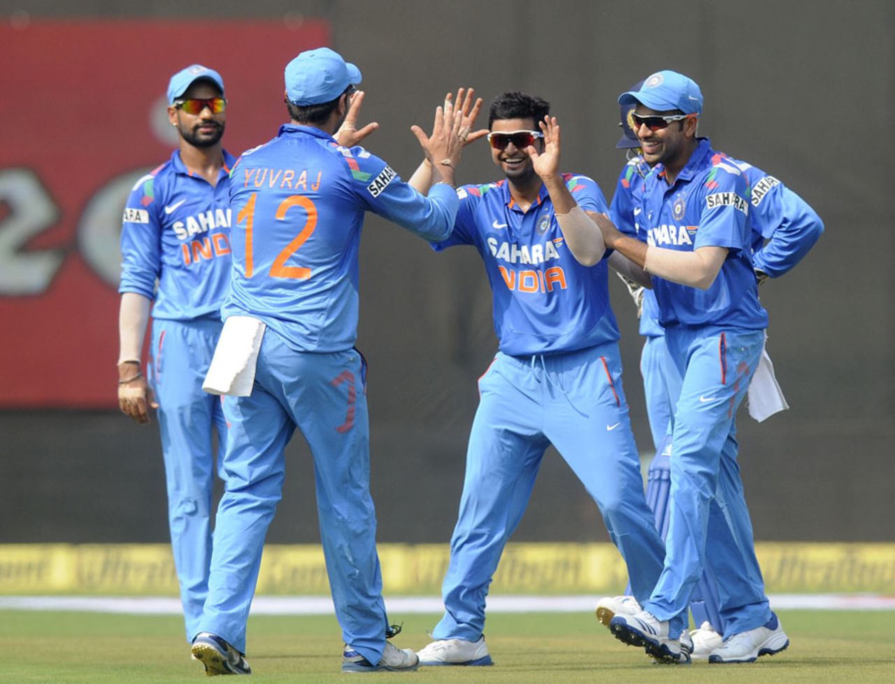 Suresh Raina celebrates the wicket of Marlon Samuels, India v West Indies, 1st ODI, Kochi, November 21, 2013