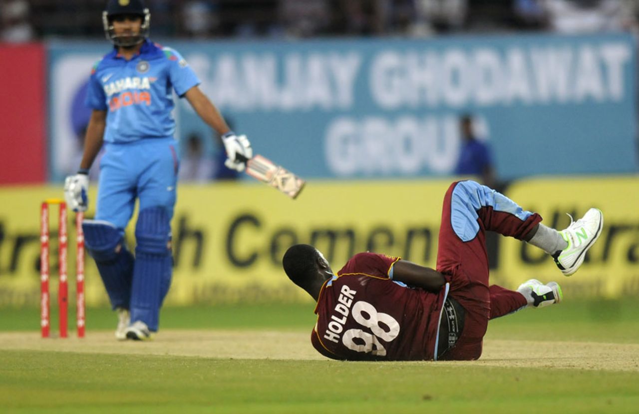 Jason Holder fell after losing his balance during a run-up, India v West Indies, 1st ODI, Kochi, November 21, 2013