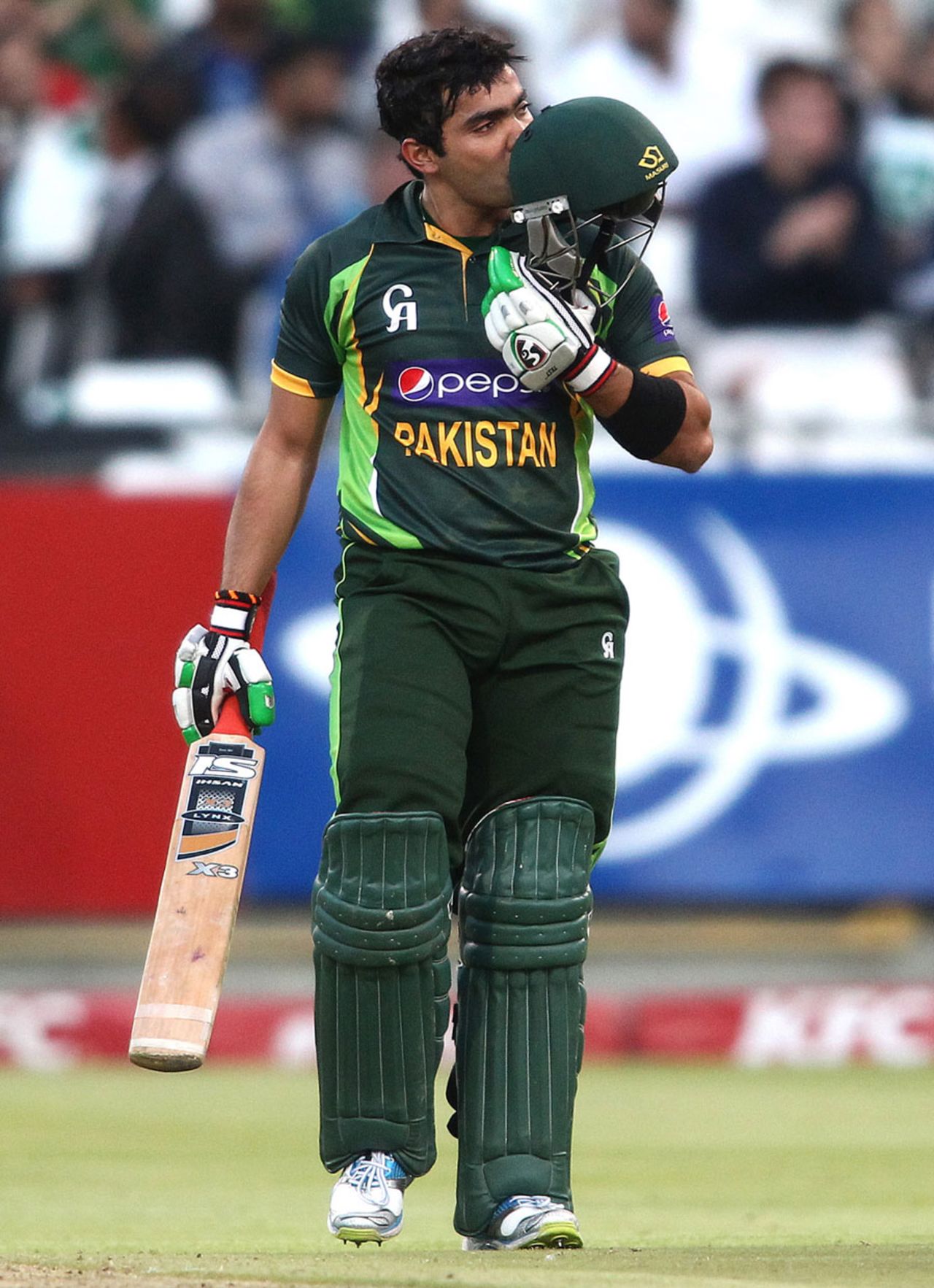 Umar Akmal kisses his helmet after getting a fifty, South Africa v Pakistan, 2nd T20I, Cape Town, November 22, 2013 