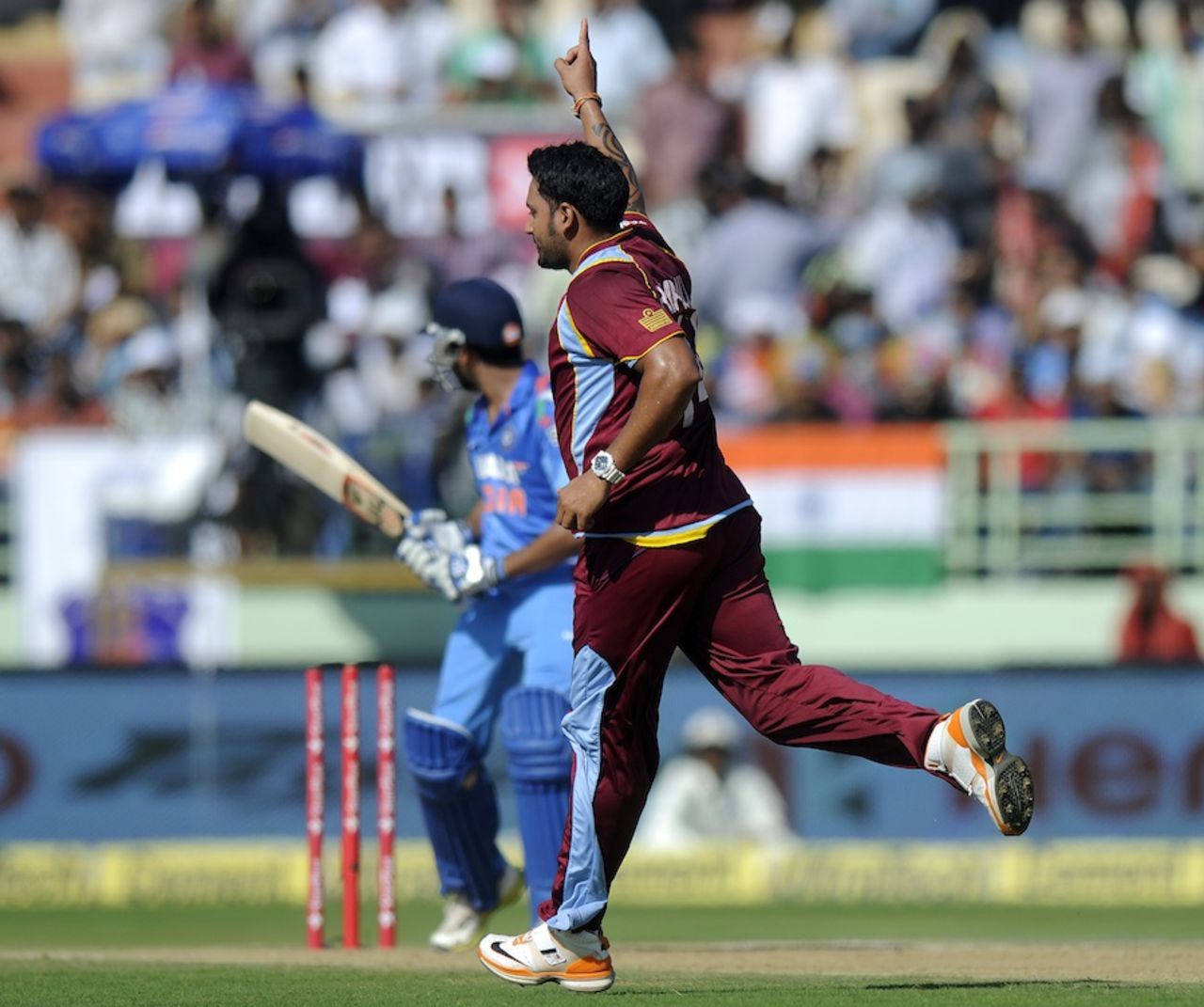 Ravi Rampaul celebrates Rohit Sharma's dismissal, India v West Indies, 2nd ODI, Visakhapatnam, November 24, 2013