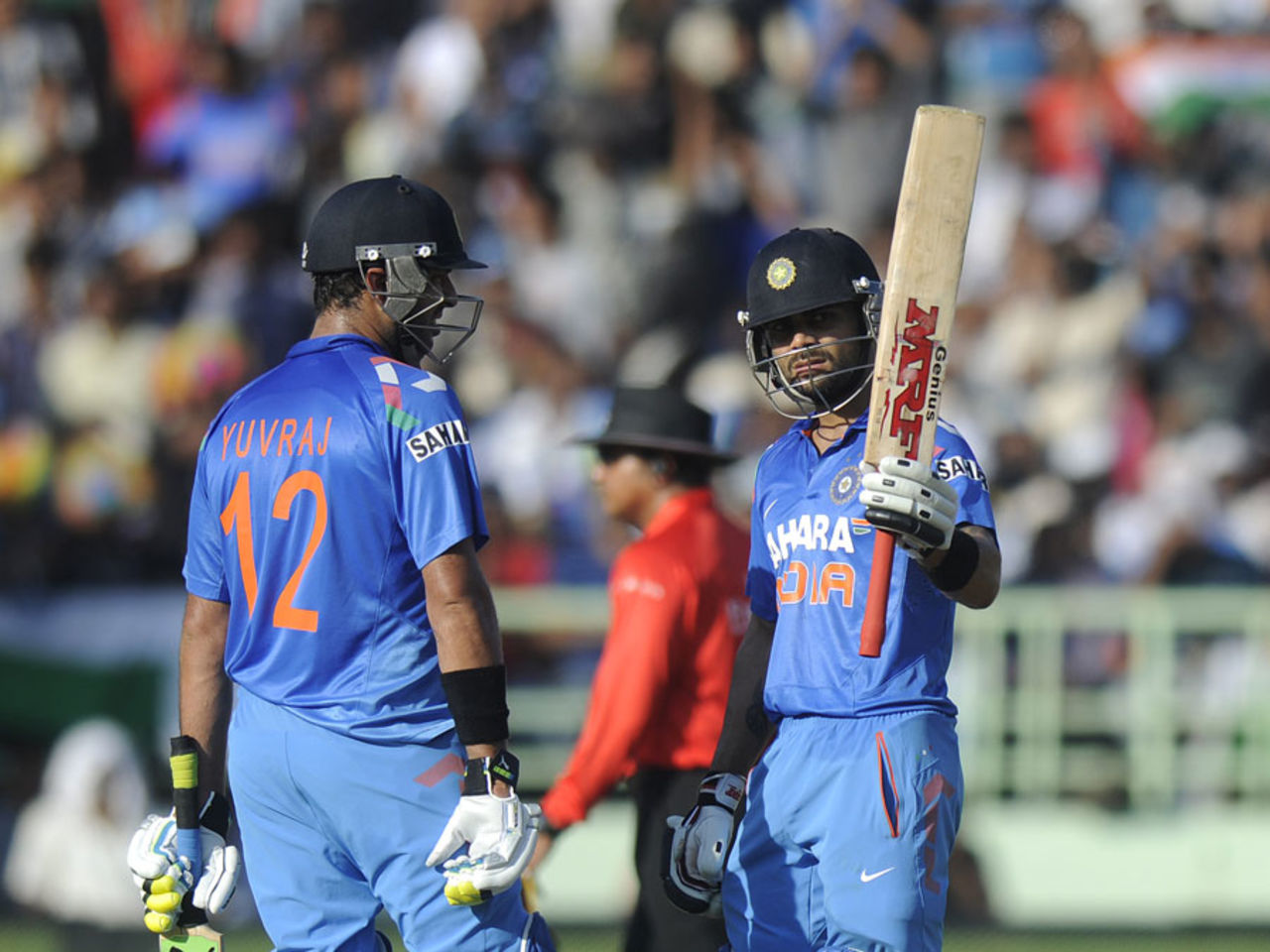Virat Kohli raises the bat after scoring fifty, India v West Indies, 2nd ODI, Visakhapatnam, November 24, 2013
