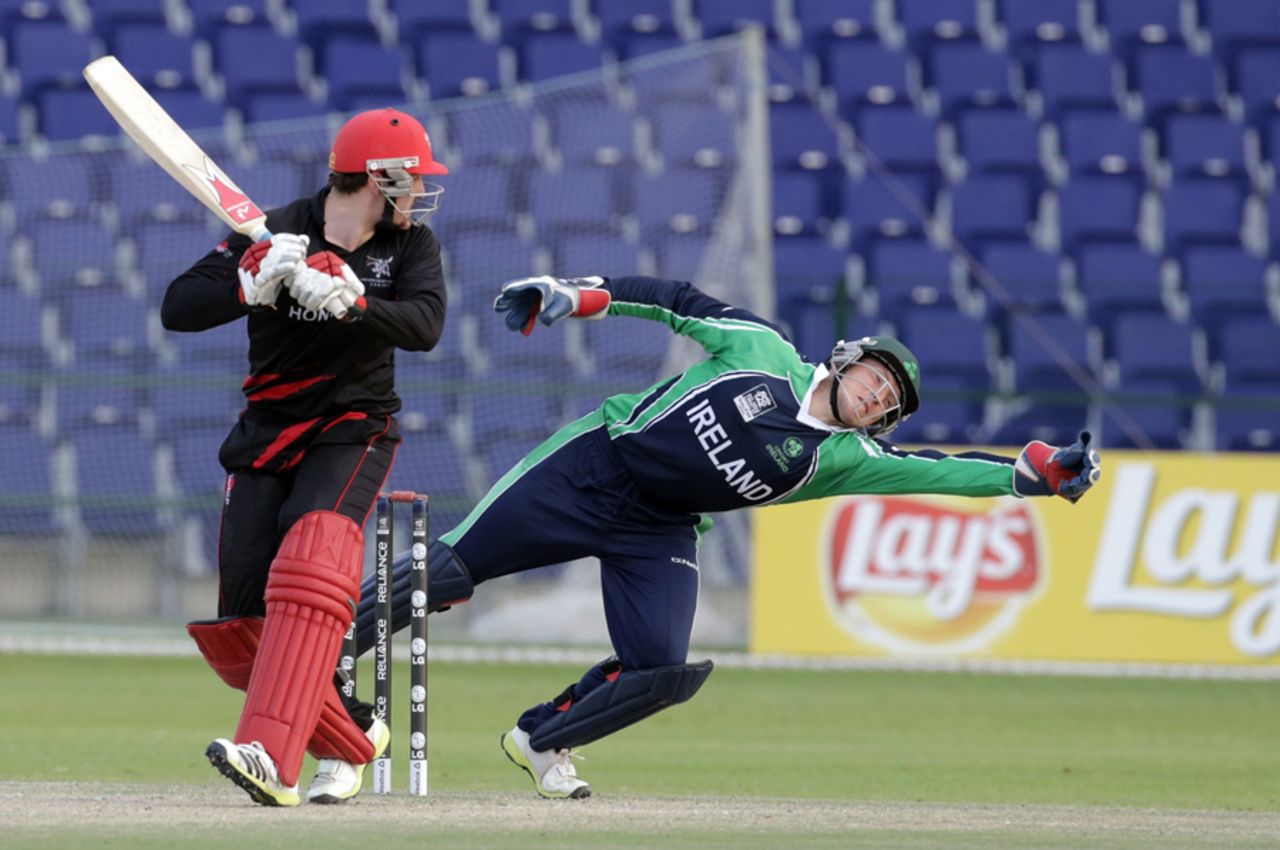 Gary Wilson of Ireland dives to save a leg side delivery during the Ireland v Hong Kong match at the ICC World Twenty20 Qualifiers at the Zayed Cricket Stadium on November 24, 2013 in Abu Dhabi, United Arab Emirates. (Photo by Graham Crouch-IDI/IDI via Getty Images)