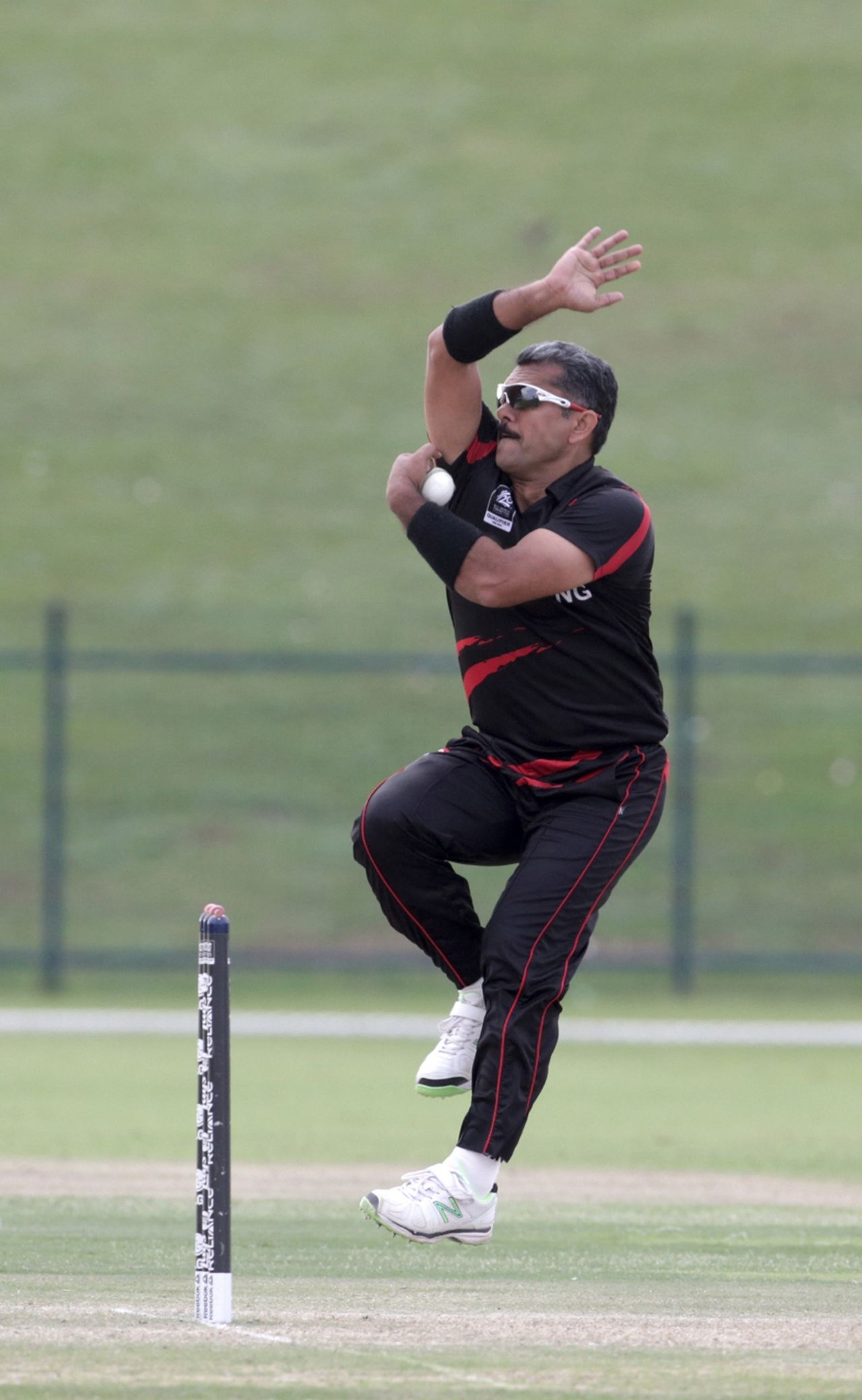Moner Ahmed of Hong Kong comes in to bowl during ICC World Twenty20 Qualifier between Ireland and Hong Kong at the Zayed Cricket Stadium on November 24, 2013 in Abu Dhabi, United Arab Emirates. (Photo by Graham Crouch-IDI/IDI via Getty Images)
