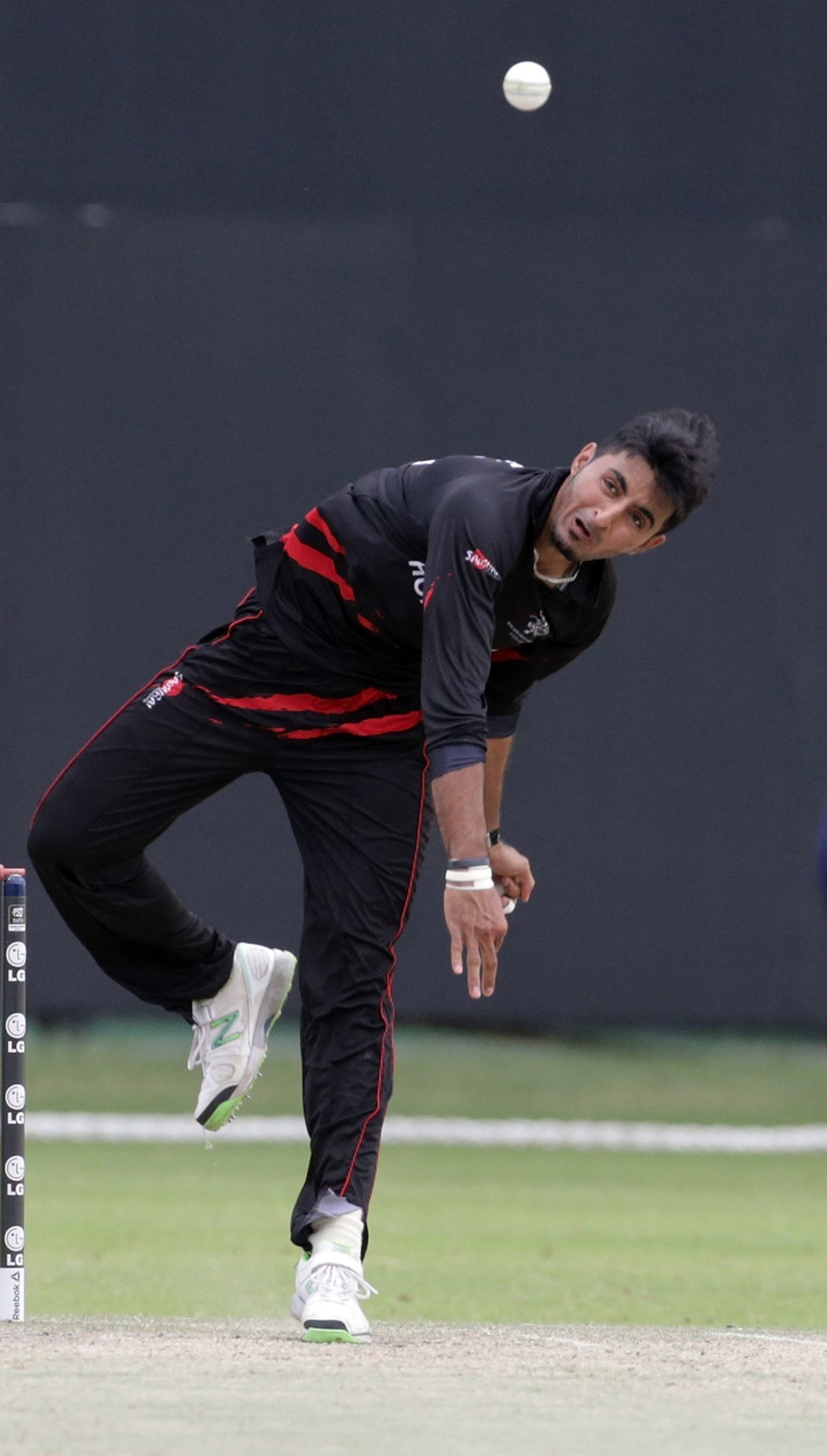 Nizakat Khan of Hong Kong comes in to bowl during ICC World Twenty20 Qualifier between Ireland and Hong Kong at the Zayed Cricket Stadium on November 24, 2013 in Abu Dhabi, United Arab Emirates. (Photo by Graham Crouch-IDI/IDI via Getty Images)
