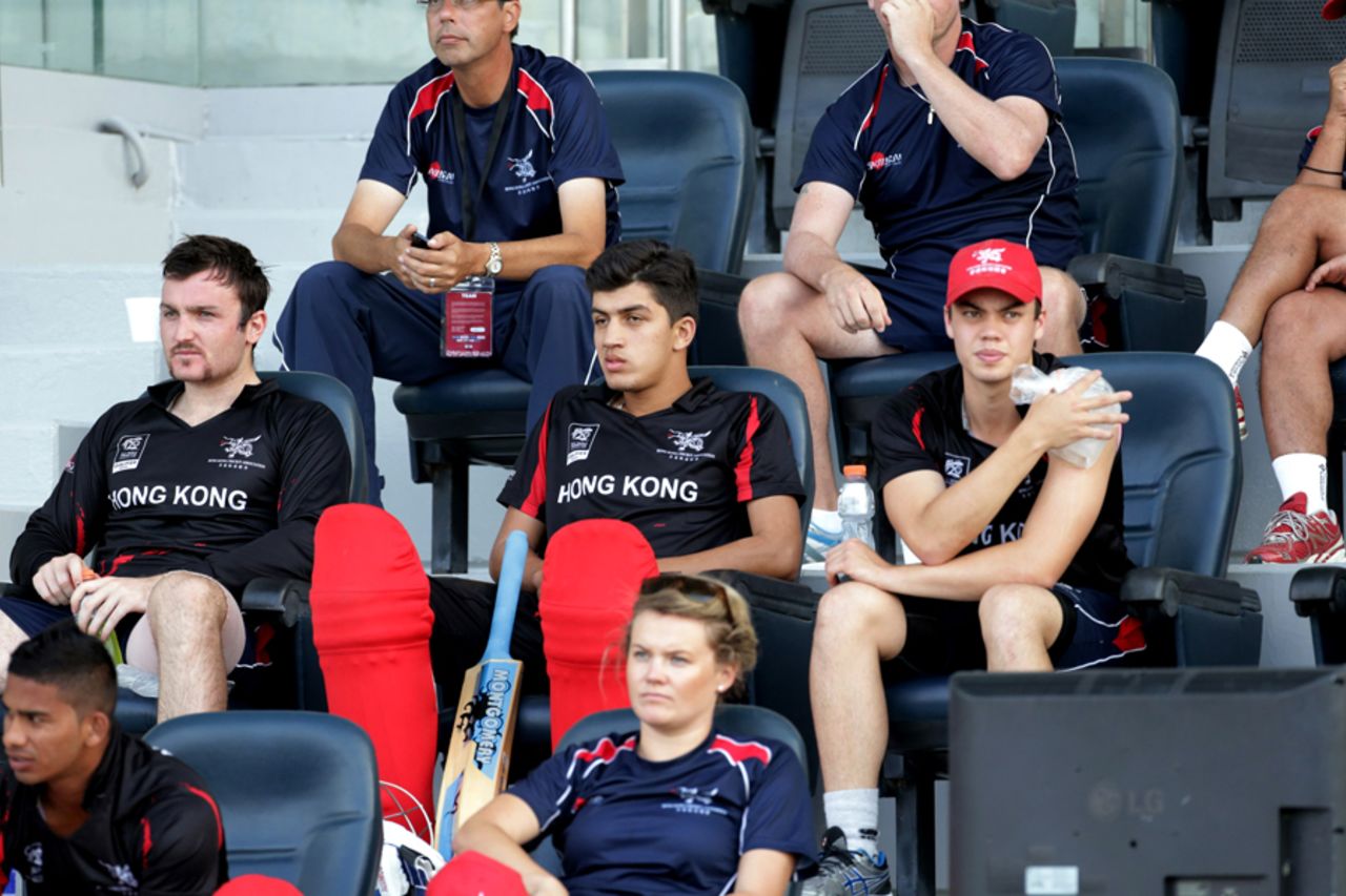 The Hong Kong players sit in their area during the Ireland v Hong Kong match at the ICC World Twenty20 Qualifiers at the Zayed Cricket Stadium on November 24, 2013 in Abu Dhabi, United Arab Emirates. (Photo by Graham Crouch-IDI/IDI via Getty Images)