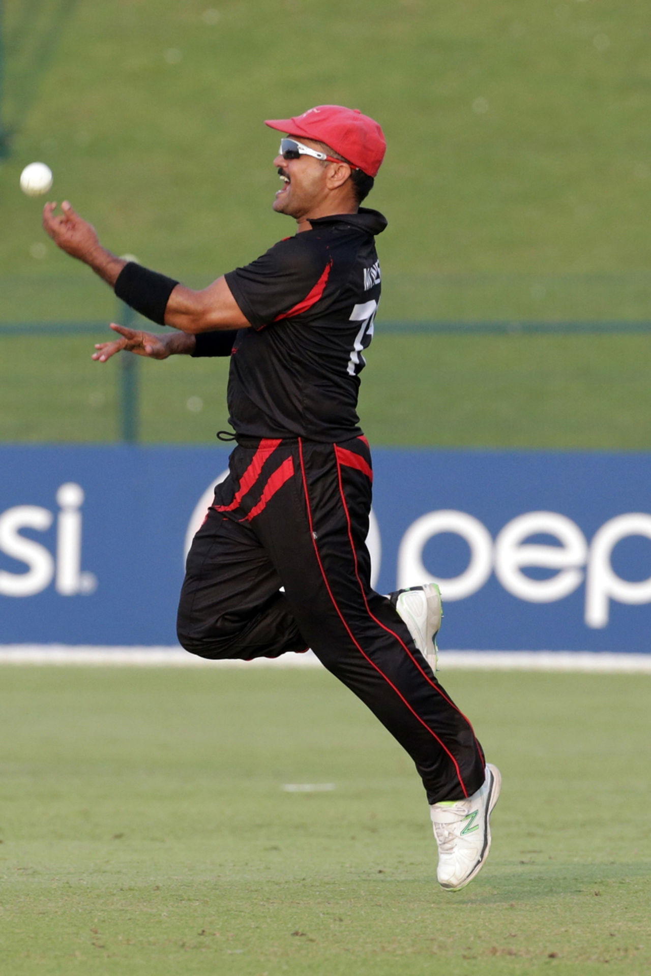 Moner Ahmed of Hong Kong celebrates a catch during the Hong Kong v UAE match at the ICC World Twenty20 Qualifiers at the Zayed Cricket Stadium on November 19, 2013 in Abu Dhabi, United Arab Emirates. (Photo by Graham Crouch-IDI/IDI via Getty Images)