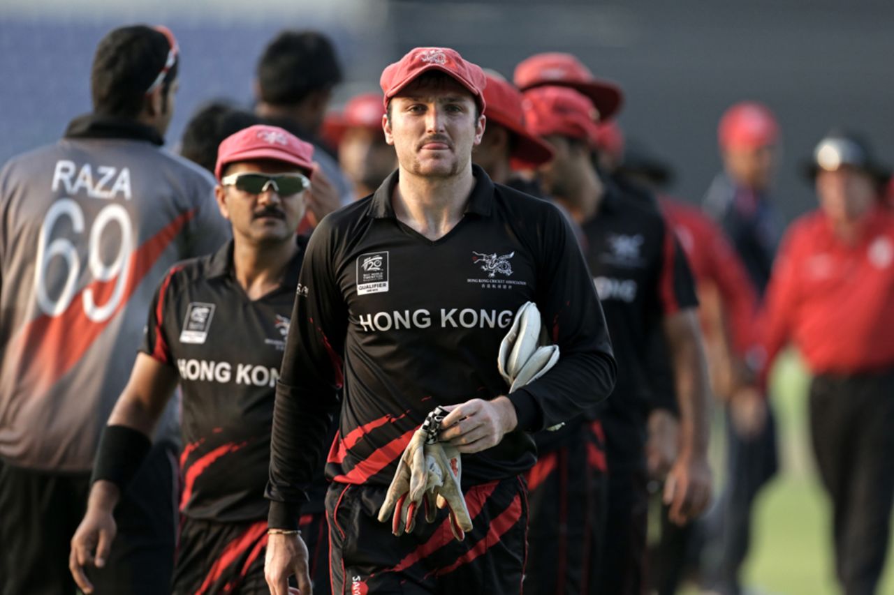 Jamie Atkinson of Hong Kong shakes hands with UAE after the Hong Kong v UAE match at the ICC World Twenty20 Qualifiers at the Zayed Cricket Stadium on November 19, 2013 in Abu Dhabi, United Arab Emirates. (Photo by Graham Crouch-IDI/IDI via Getty Images)
