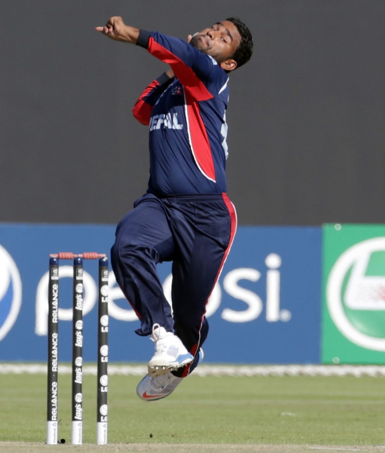 Jitendra Mukhiya in his delivery stride, Hong Kong v Nepal, ICC World Twenty20 Qualifier, quarter-final, Abu Dhabi, November 27, 2013