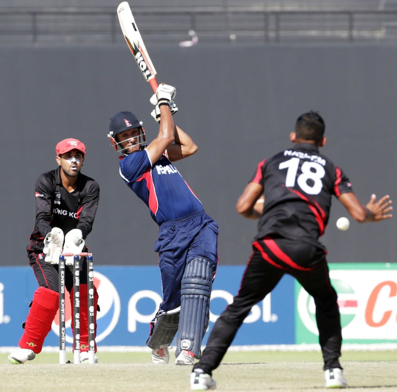 Paras Khadka smashes one down the ground, Hong Kong v Nepal, ICC World Twenty20 Qualifier, quarter-final, Abu Dhabi, November 27, 2013