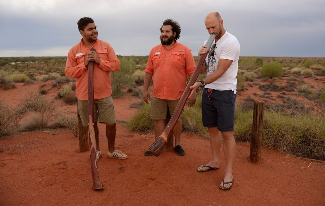 Matt Prior has a go on a didgeridoo, Ayers Rock, November 27, 2013