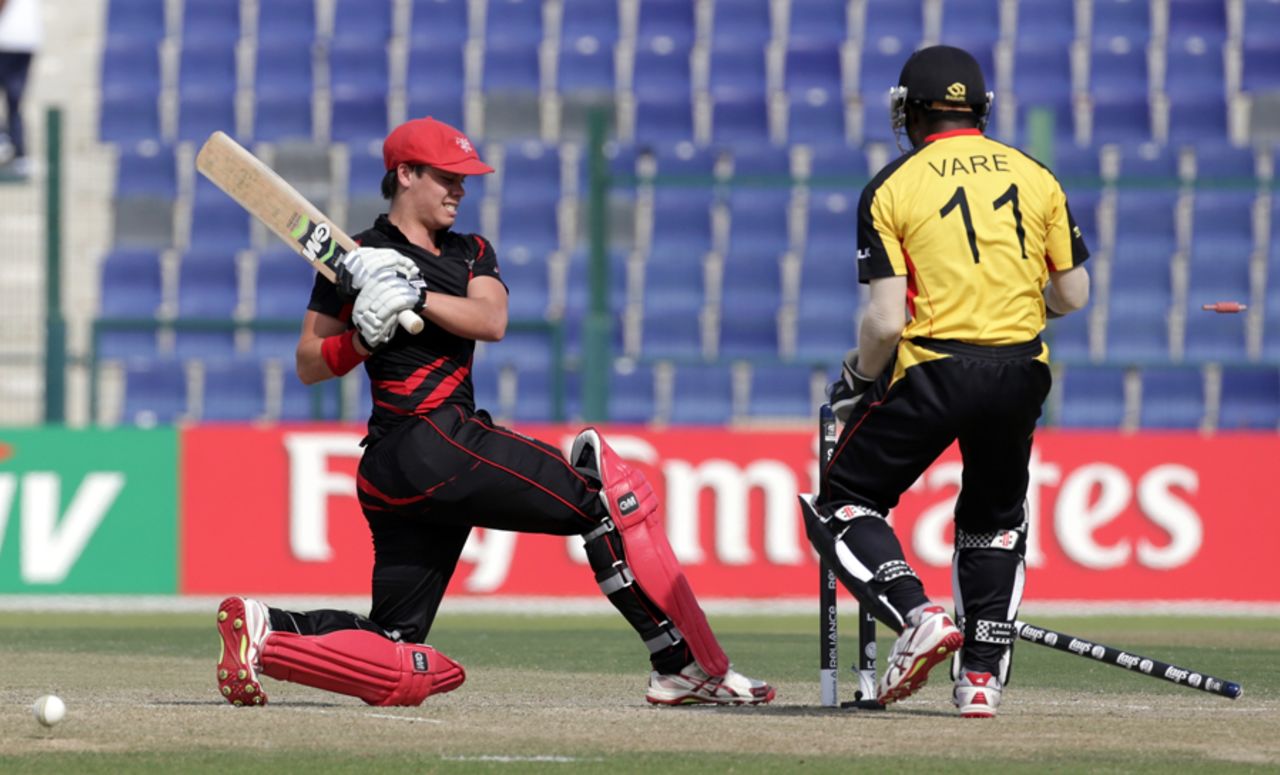 Mark Chapman is bowled by Mahuru Dai of PNG during the Papua New Guinea v Hong Kong Qualifying Play-off match 64 at the ICC World Twenty20 Qualifiers at the Zayed Cricket Stadium on November 28, 2013 in Abu Dhabi, United Arab Emirates. (Photo by Graham Crouch-IDI/IDI via Getty Images)