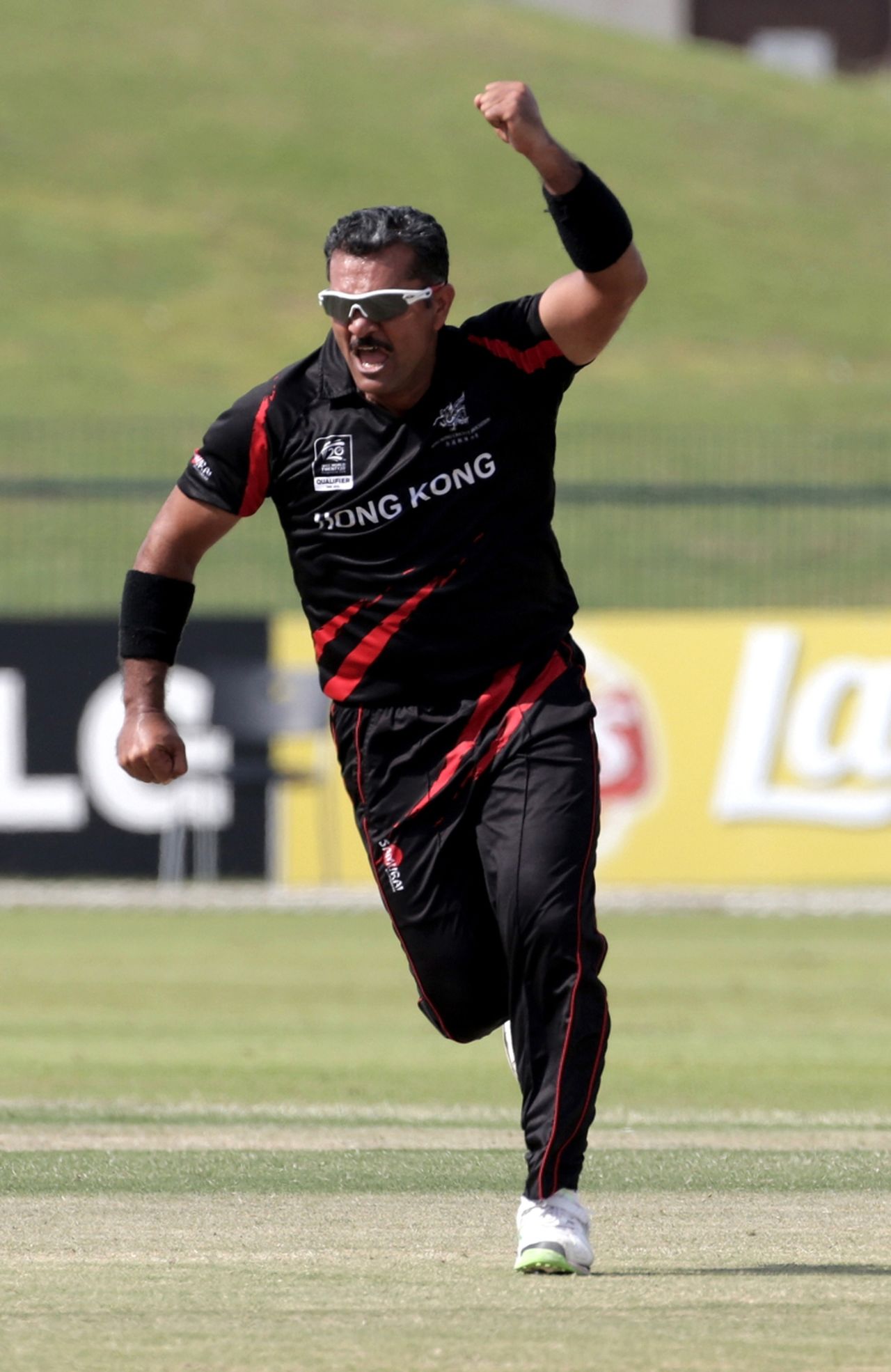 Moner Ahmed of Hong Kong celebrates a catch off his own bowling during the Papua New Guinea v Hong Kong Qualifying Play-off match at the ICC World Twenty20 Qualifiers at the Zayed Cricket Stadium on November 28, 2013 in Abu Dhabi, United Arab Emirates. (Photo by Graham Crouch-IDI/IDI via Getty Images)