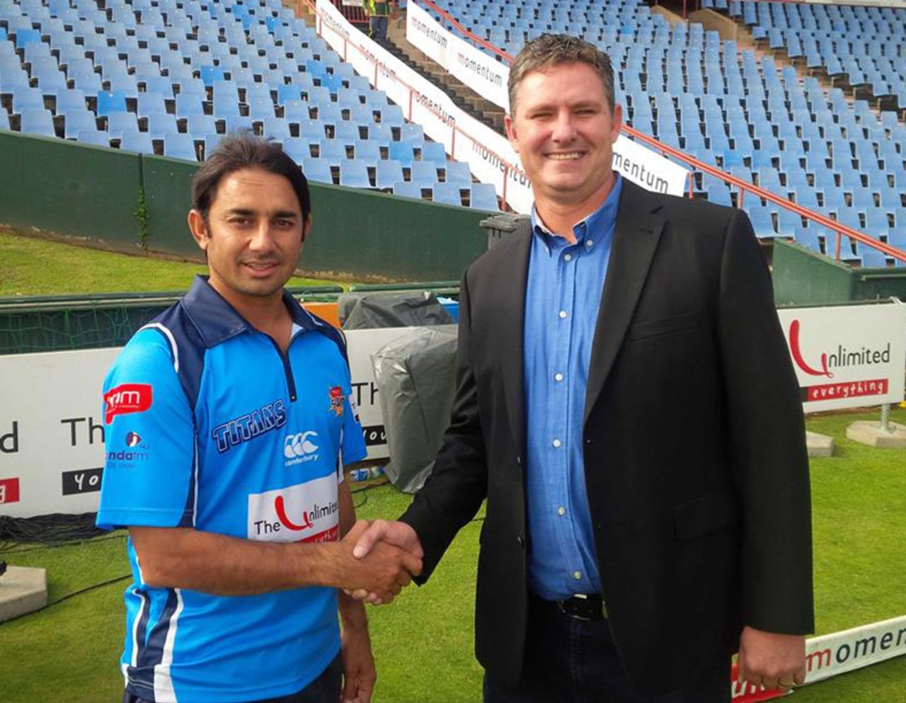 Saeed Ajmal with Titans CEO Jacques Faul, after signing with the franchise, Centurion, November 29, 2013