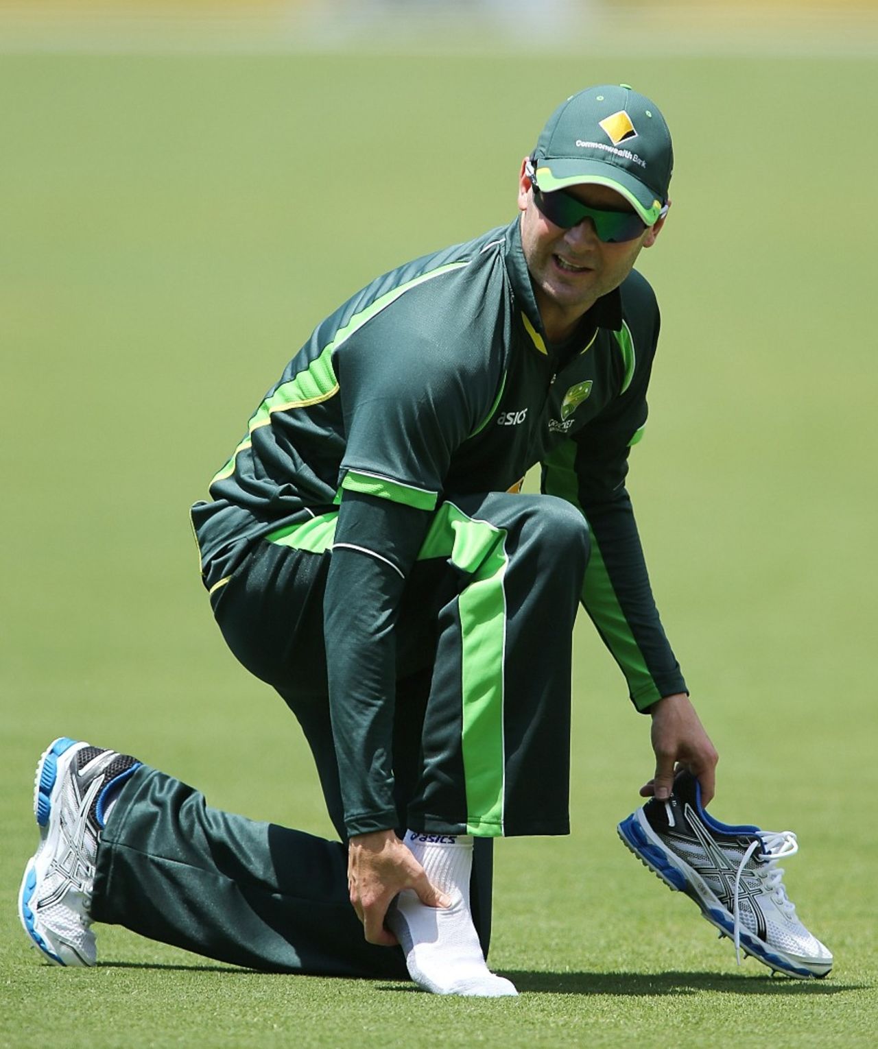 Michael Clarke checks on his ankle after rolling it at training, Adelaide, December 2, 2013