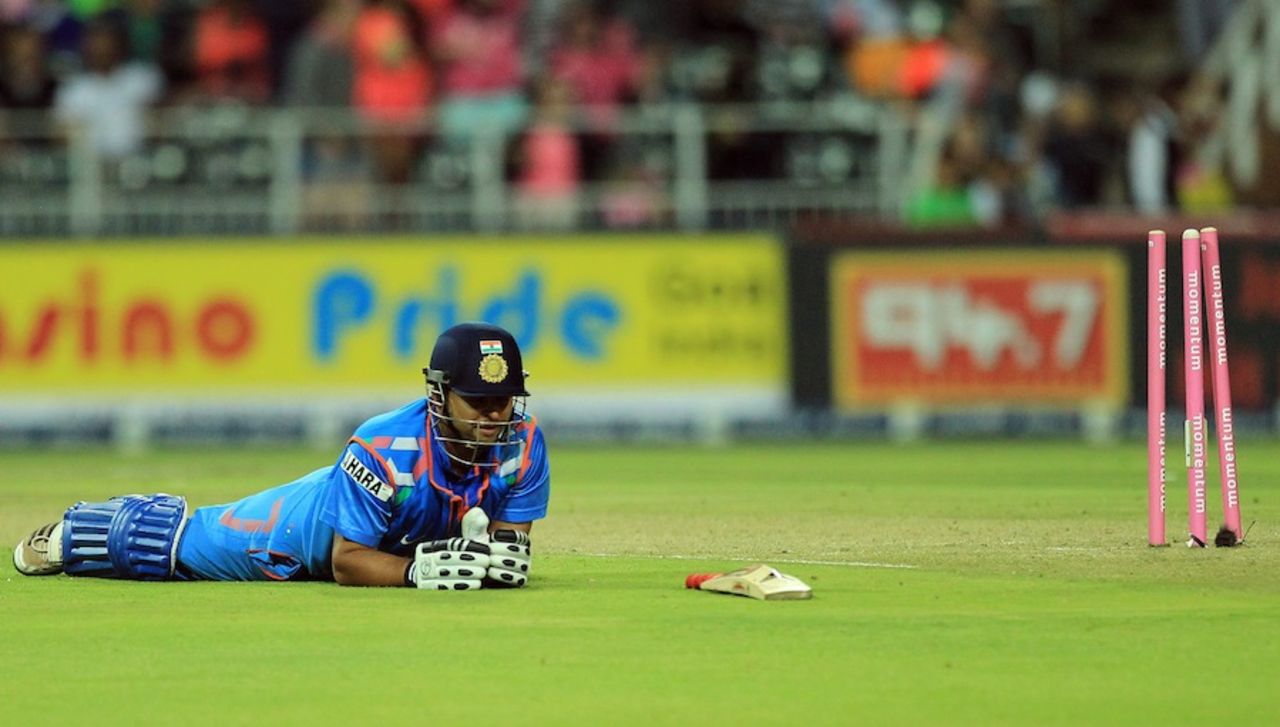 Suresh Raina lies on the ground after being run-out, South Africa v India, 1st ODI, Johannesburg, December 5, 2013