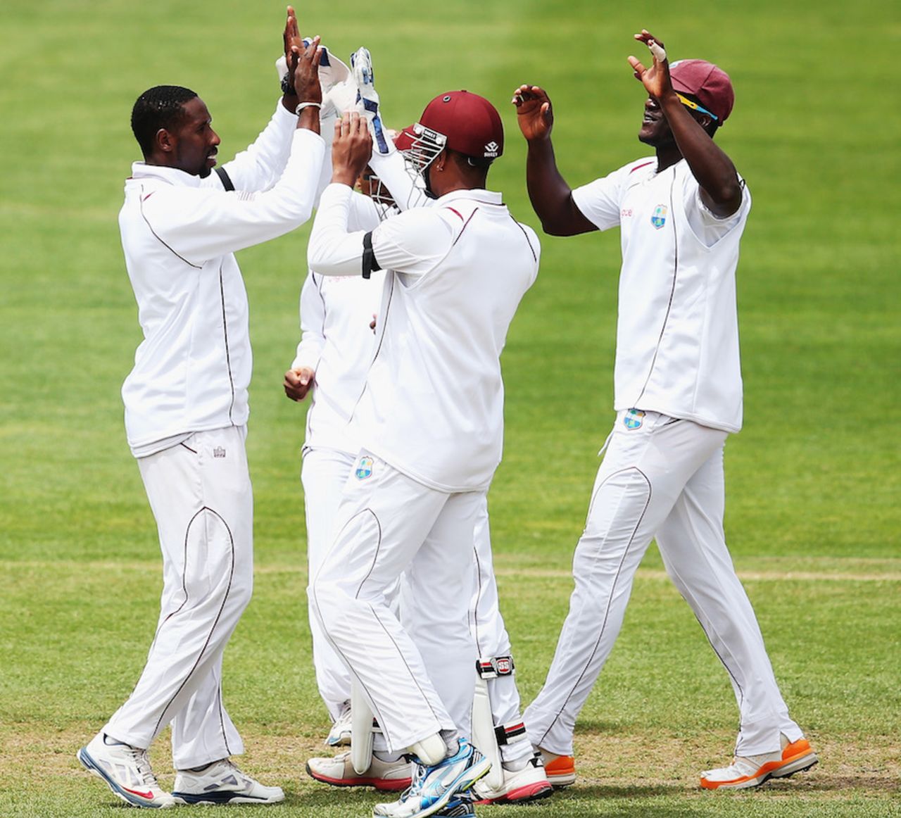 Shane Shillingford is mobbed after he picked his third wicket, New Zealand v West Indies, 1st Test, Dunedin, 5th day, December 7, 2013