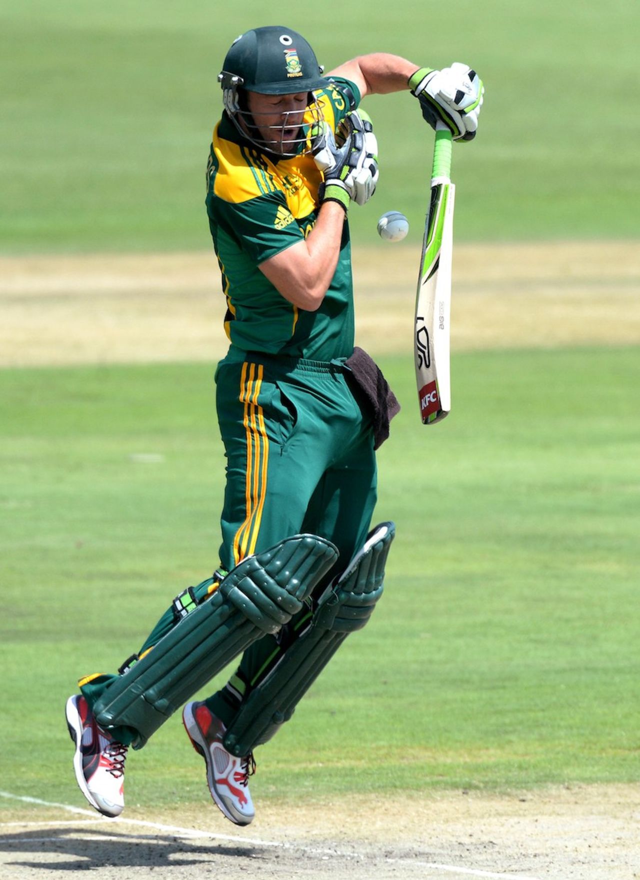AB de Villiers fends off a short ball, South Africa v India, 3rd ODI, Centurion, December 11, 2013
