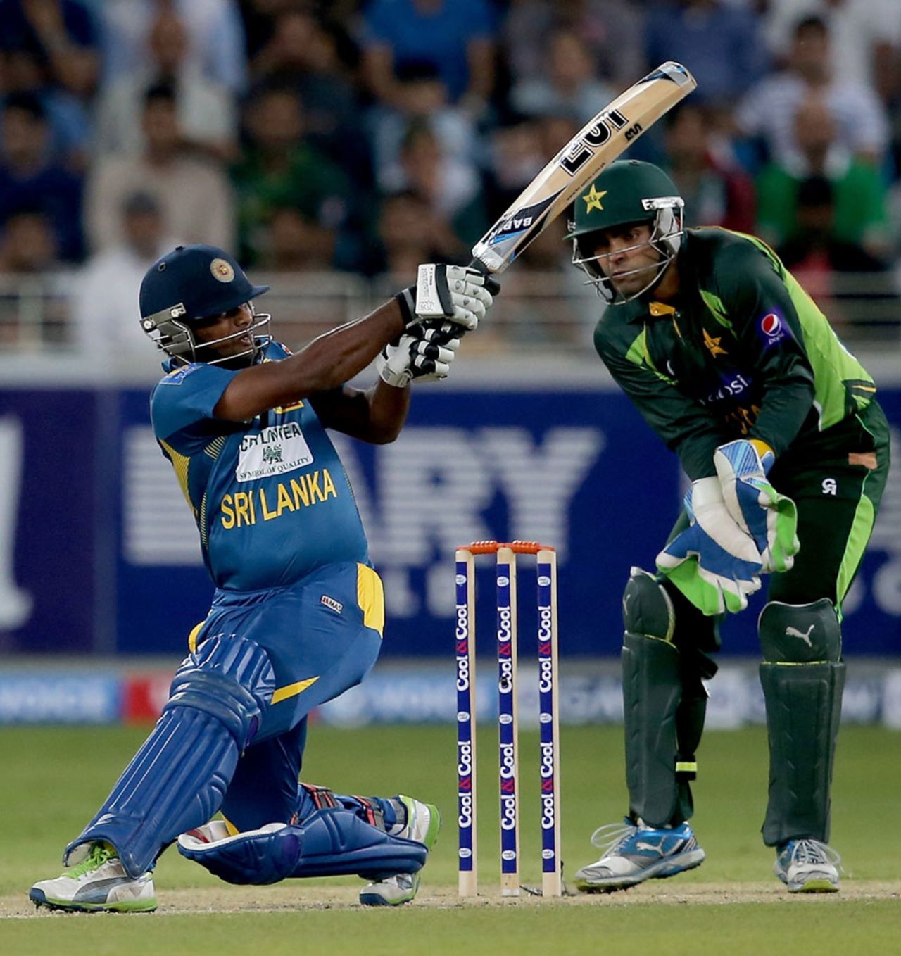 Seekkuge Prasanna plays a lofted sweep, Pakistan v Sri Lanka, 2nd T20, Dubai, December 13, 2013
