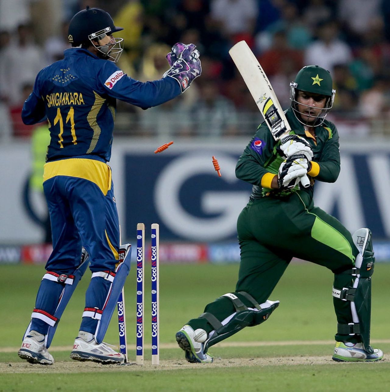 Sharjeel Khan looks behind to find his leg stump knocked back, Pakistan v Sri Lanka, 2nd T20, Dubai, December 13, 2013