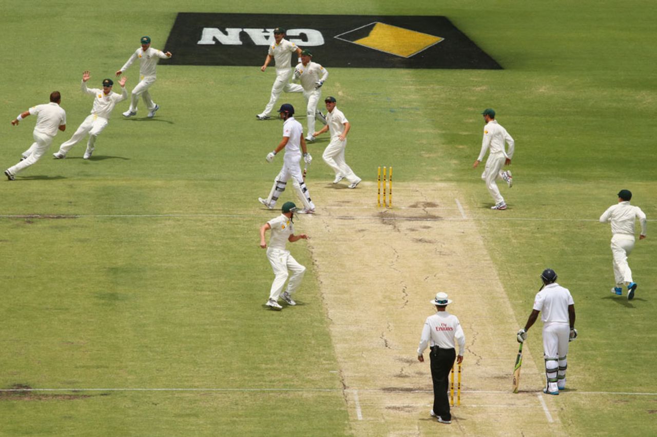 The Australia team celebrate Alastair Cook's dismissal, Australia v England, Test, Perth, 4th day, December 16, 2013