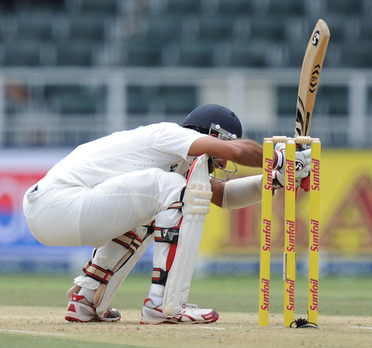 Cheteshwar Pujara ducks low under a bouncer, South Africa v India, 1st Test, Johannesburg, 1st day, December 18, 2013