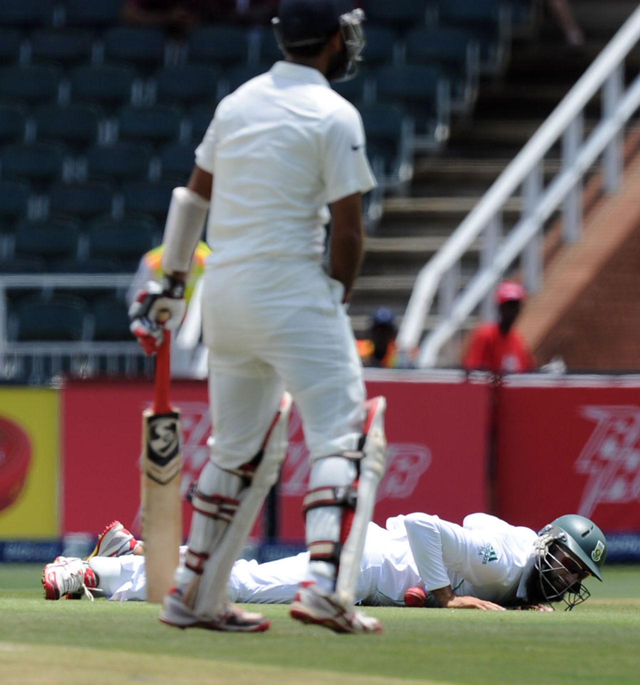 Hashim Amla grasses a chance at short leg, South Africa v India, 1st Test, Johannesburg, 1st day, December 18, 2013