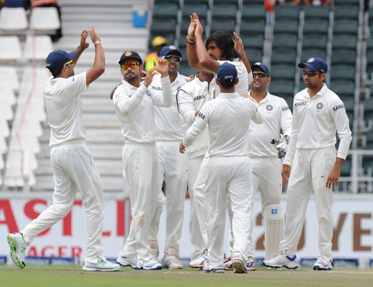 Ishant Sharma is congratulated after picking up the wicket of Alviro Petersen, South Africa v India, 1st Test, Johannesburg, 2nd day, December 19, 2013