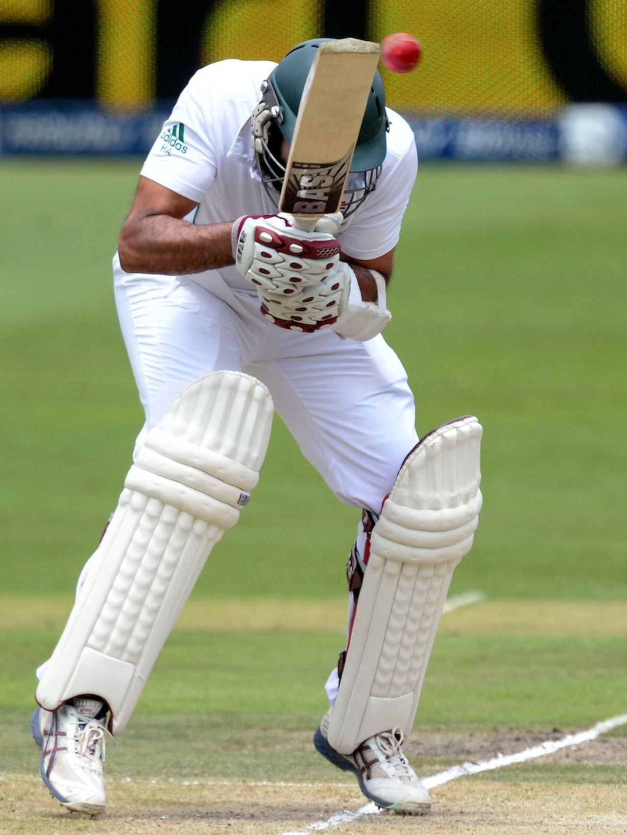 Hashim Amla ducks under a short ball, South Africa v India, 1st Test, Johannesburg, 2nd day, December 19, 2013