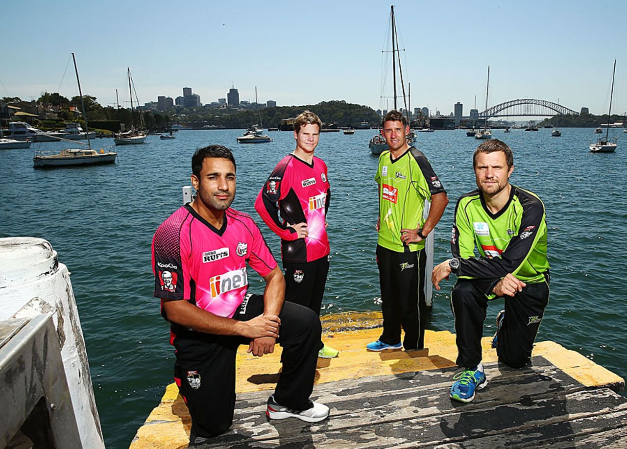Ravi Bopara, Steven Smith, Michael Hussey and Dirk Nannes pose with the Sydney Harbour Bridge at the background, Sydney, December 20, 2013