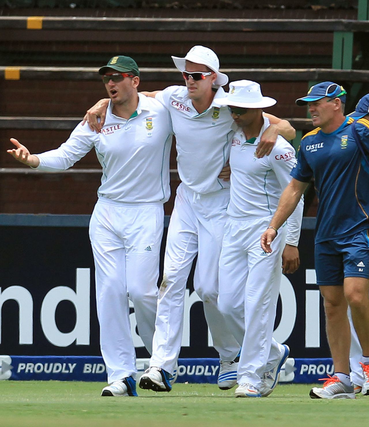 Morne Morkel is helped off the field after he injured his ankle, South Africa v India, 1st Test, Johannesburg, 3rd day, December 20, 2013