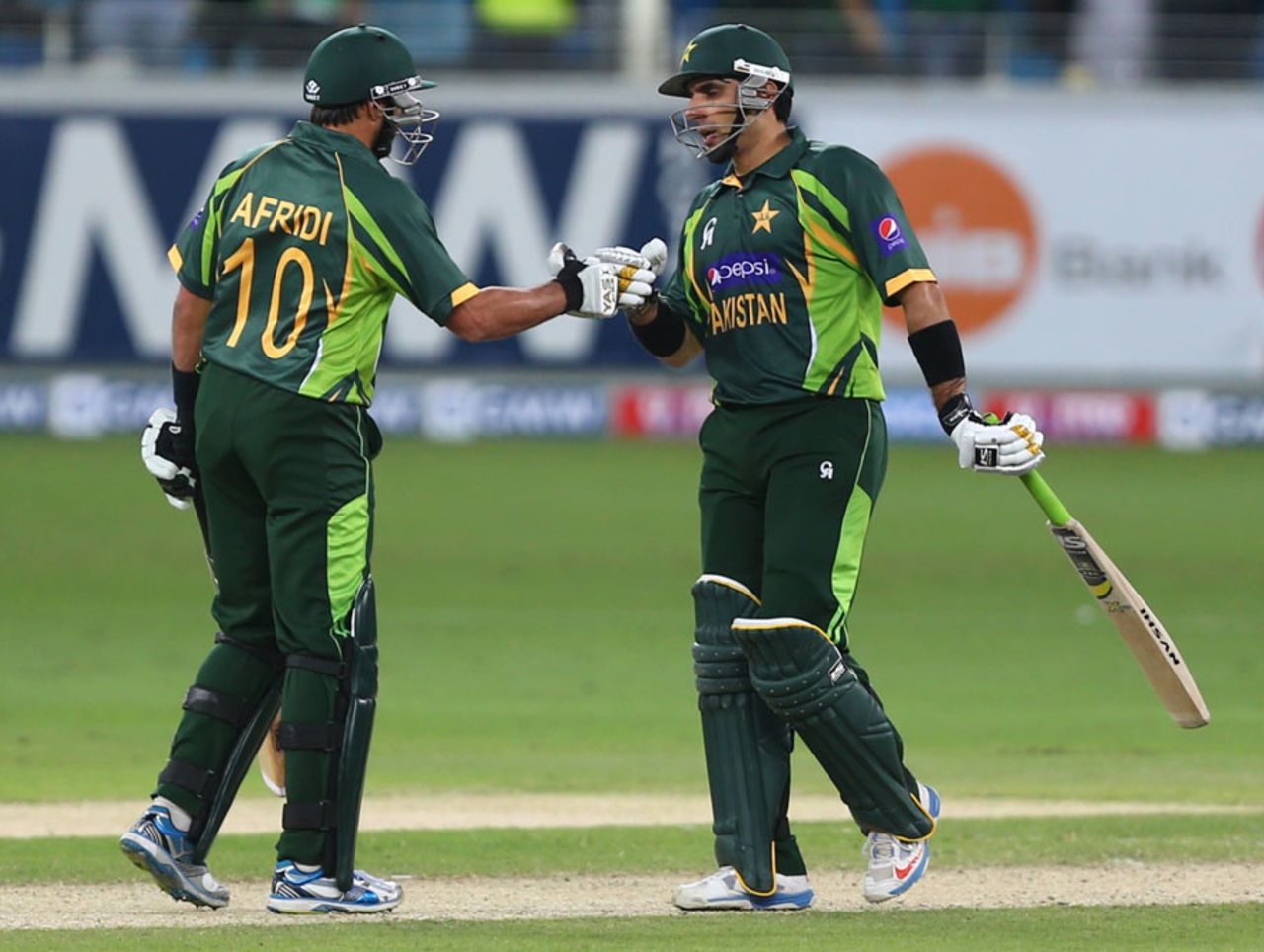 Misbah-ul-Haq and Shahid Afridi punch gloves, Pakistan v Sri Lanka, 2nd ODI, Dubai, December 20, 2013
