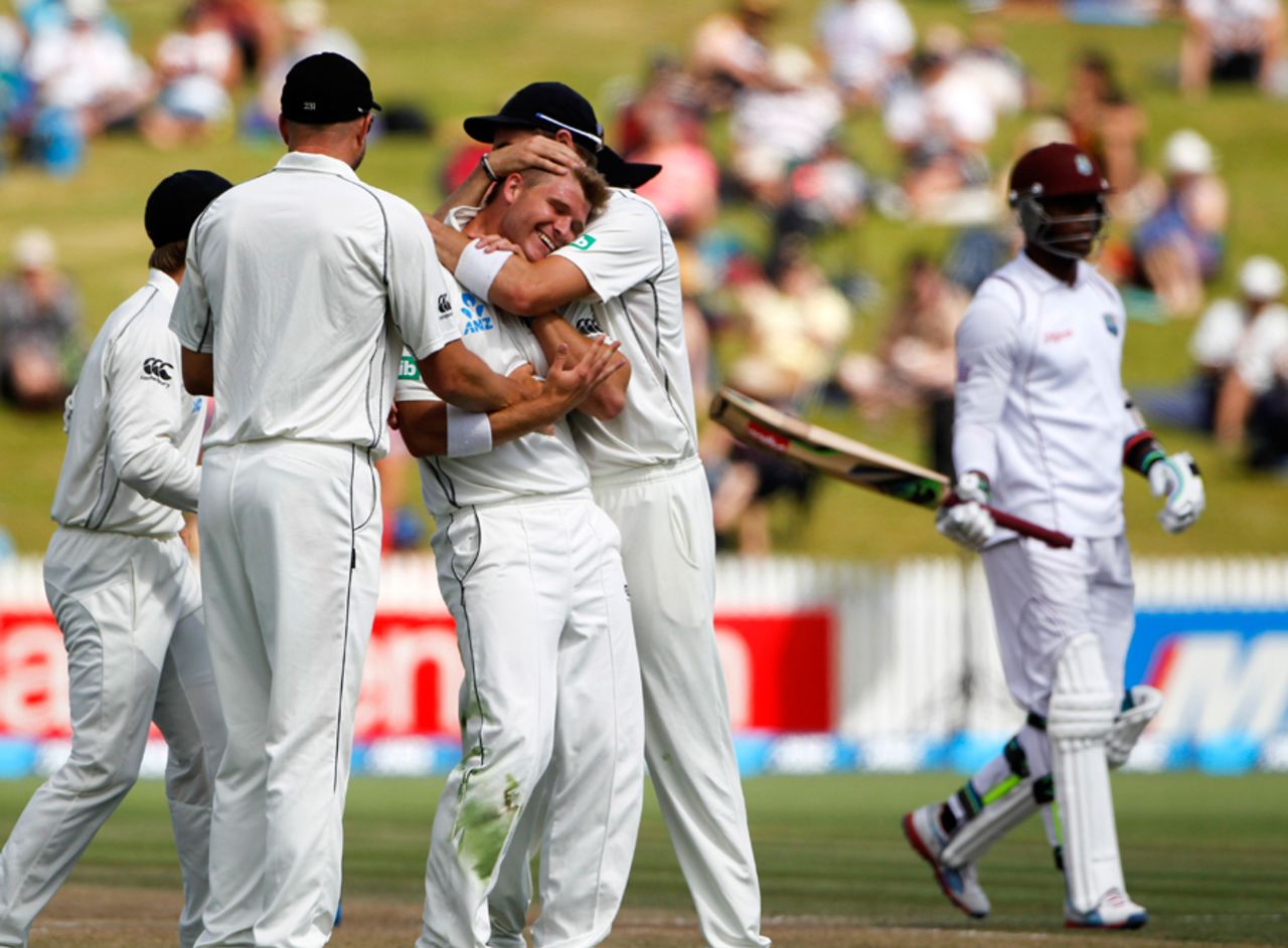 Corey Anderson gets a hug from team-mates after striking, New Zealand v West Indies, 3rd Test, Hamilton, 3rd day, December 21, 2013