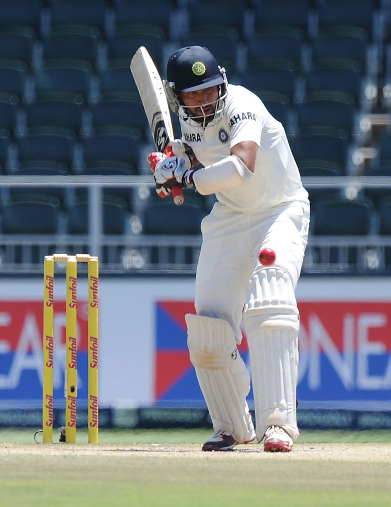 Cheteshwar Pujara keeps his eye on the ball, South Africa v India, 1st Test, Johannesburg, 4th day, December 21, 2013