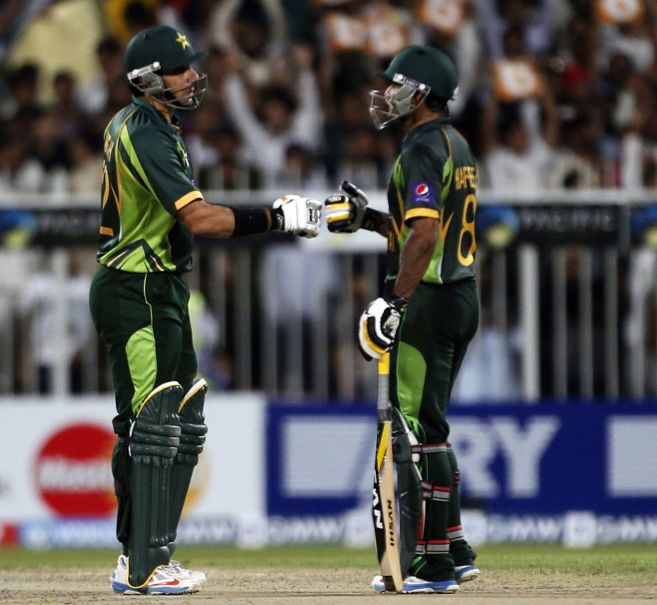 Mohammad Hafeez and Misbah-ul-Haq punch gloves, Pakistan v Sri Lanka, 3rd ODI, Sharjah, December 22, 2013
