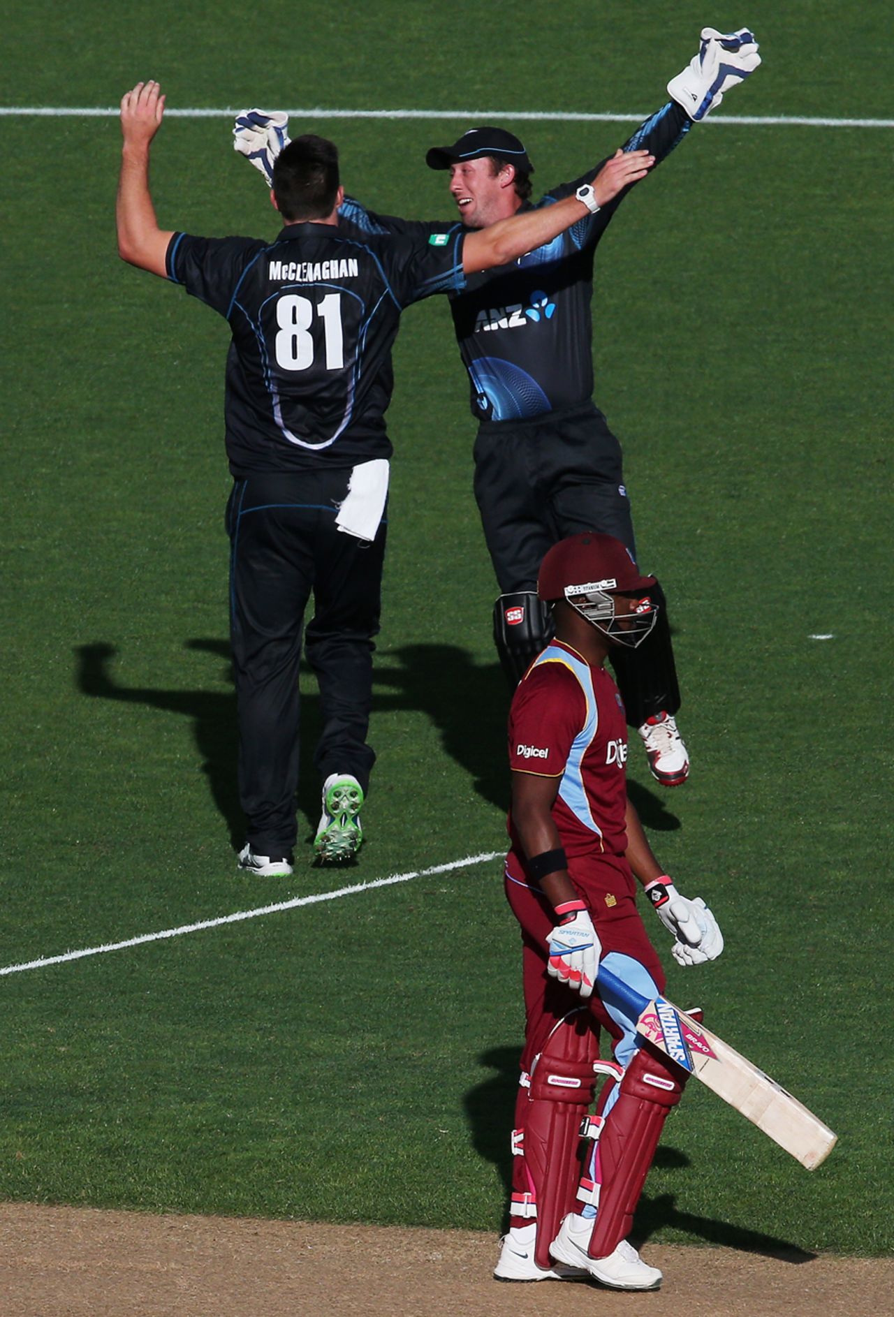 Darren Bravo walks off as Mitchell McClenaghan celebrates, New Zealand v West Indies, 1st ODI, Auckland, December 26, 2013