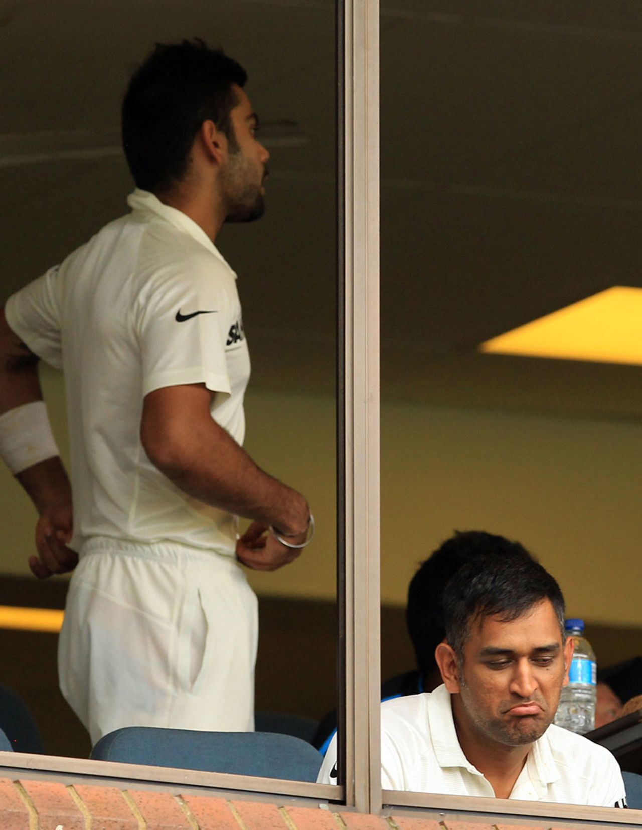 MS Dhoni is in a relaxed mood as play is held up by bad light, South Africa v India, 2nd Test, Durban, 1st day, December 26, 2013