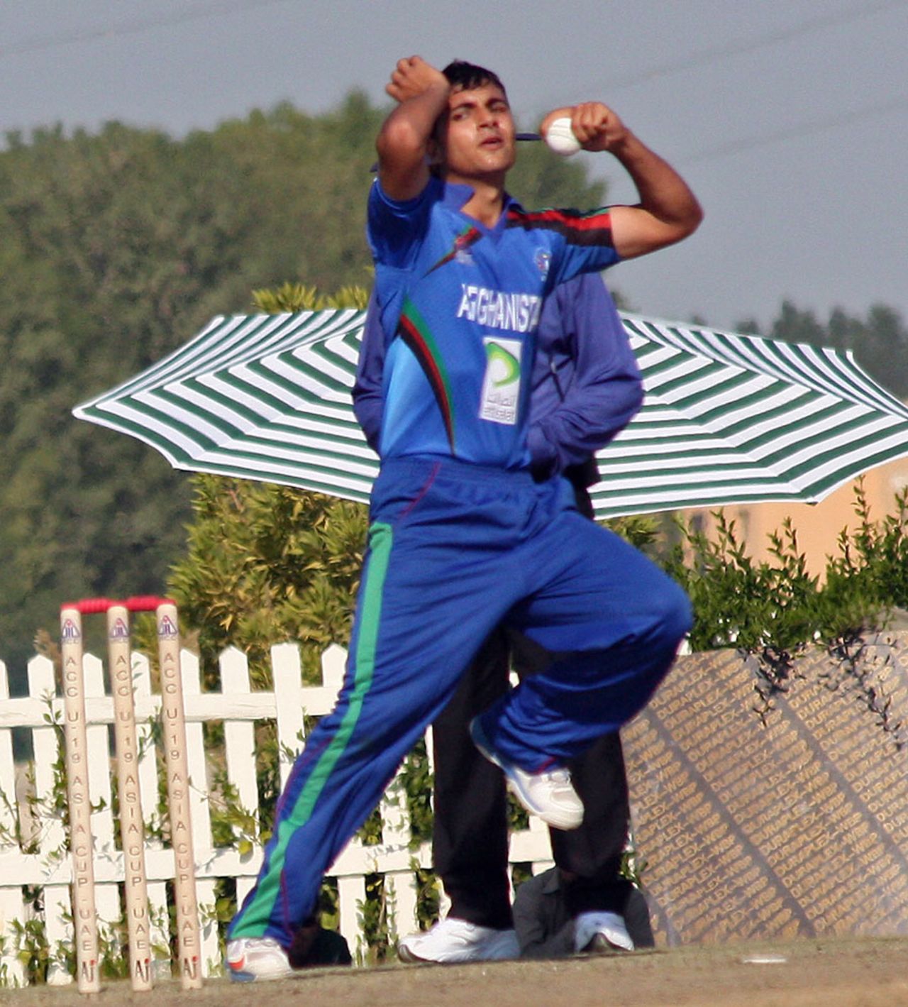 Left-arm spinner Zia-ur-Rehman in his delivery stride, Afghanistan Under-19 v Sri Lanka Under-19, Under-19 Asia Cup, Abu Dhabi, December 28, 2013