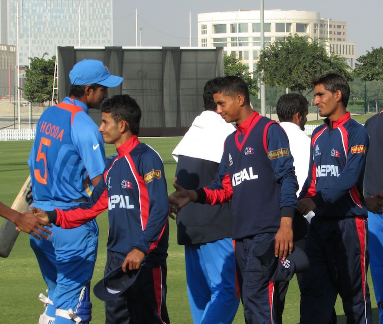 Nepal and India Under-19 players shake hands, India Under-19 v Nepal Under-19, Under-19 Asia Cup, Dubai, December 29, 2013