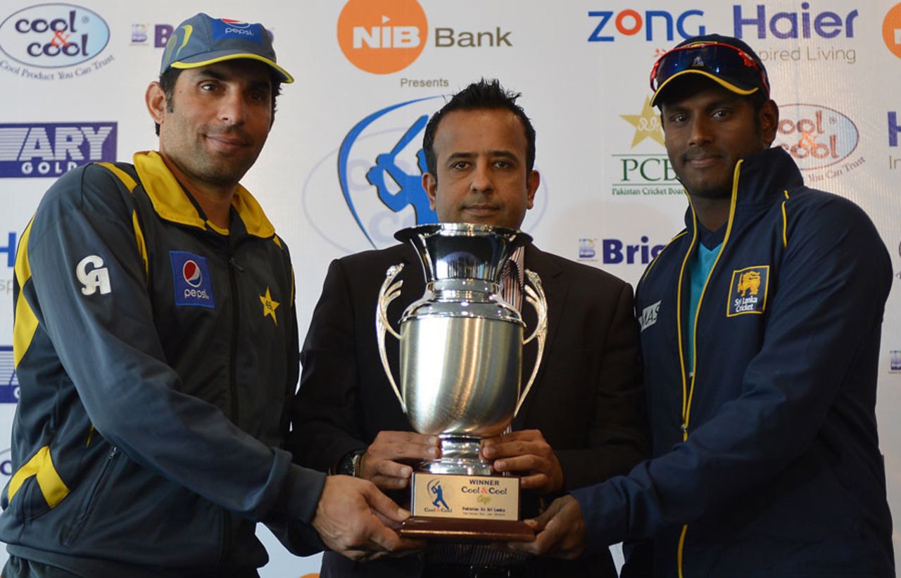 Misbah-ul-Haq and Angelo Mathews with the series trophy, Abu Dhabi, December 30, 2013