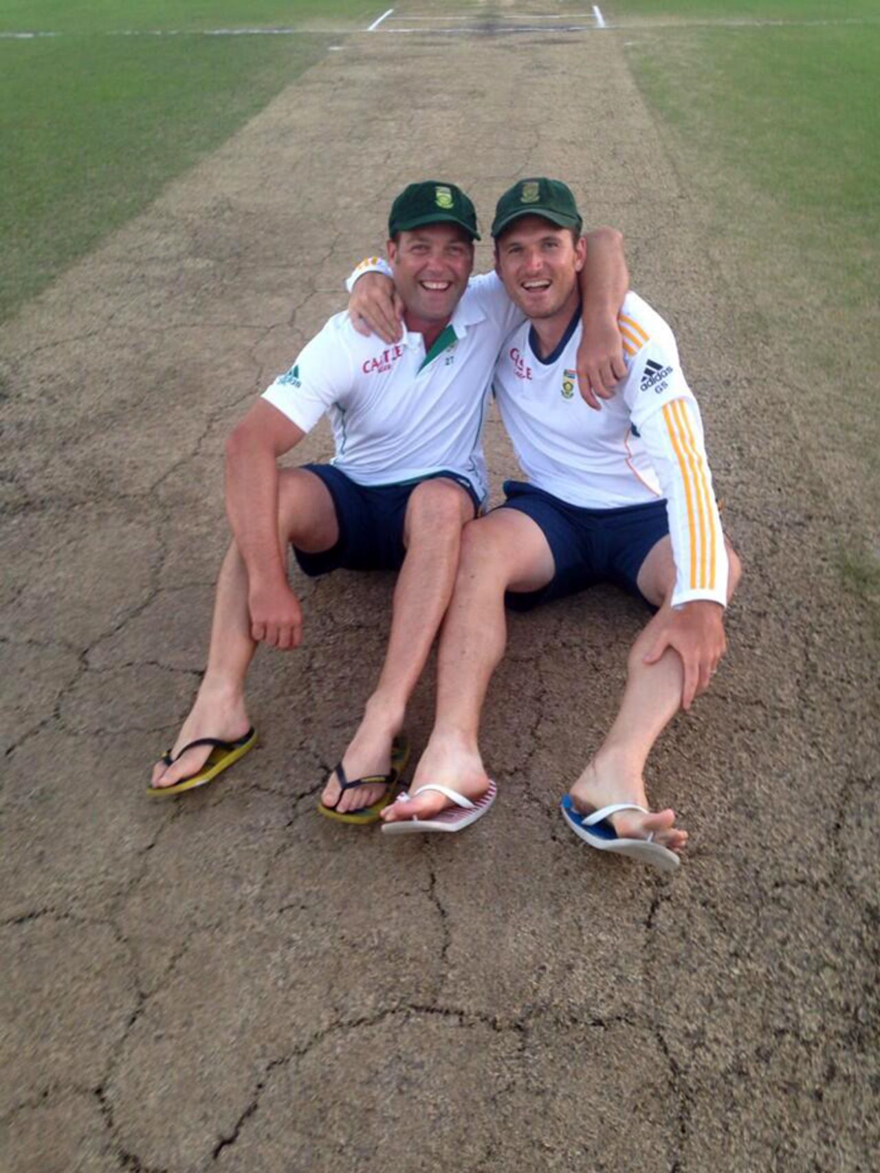Jacques Kallis and Graeme Smith relax on the Kingsmead pitch, South Africa v India, 2nd Test, Durban, 5th day, December 30, 2013