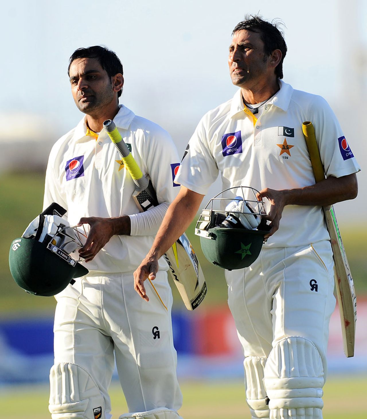 Younis Khan and Mohammad Hafeez walk off the field, Pakistan v Sri Lanka, 1st Test, Abu Dhabi, 5th day January 4, 2014