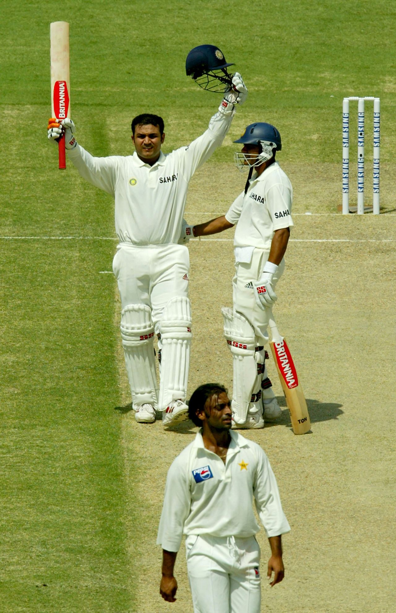At a strike rate of 82, Virender Sehwag gets to 300 with a massive six, while Sachin Tendulkar ends his innings unbeaten on 194, Pakistan v India, 1st Test, Multan, 2nd day, March 29, 2004