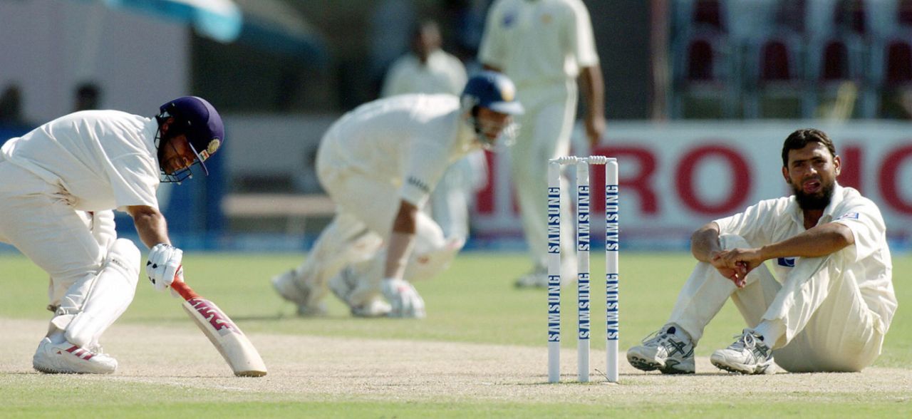 Saqlain Mushtaq sits on the pitch as Sachin Tendulkar and Yuvraj Singh pile on the runs, Pakistan v India, 1st Test, Multan, 2nd day, March 29, 2004
