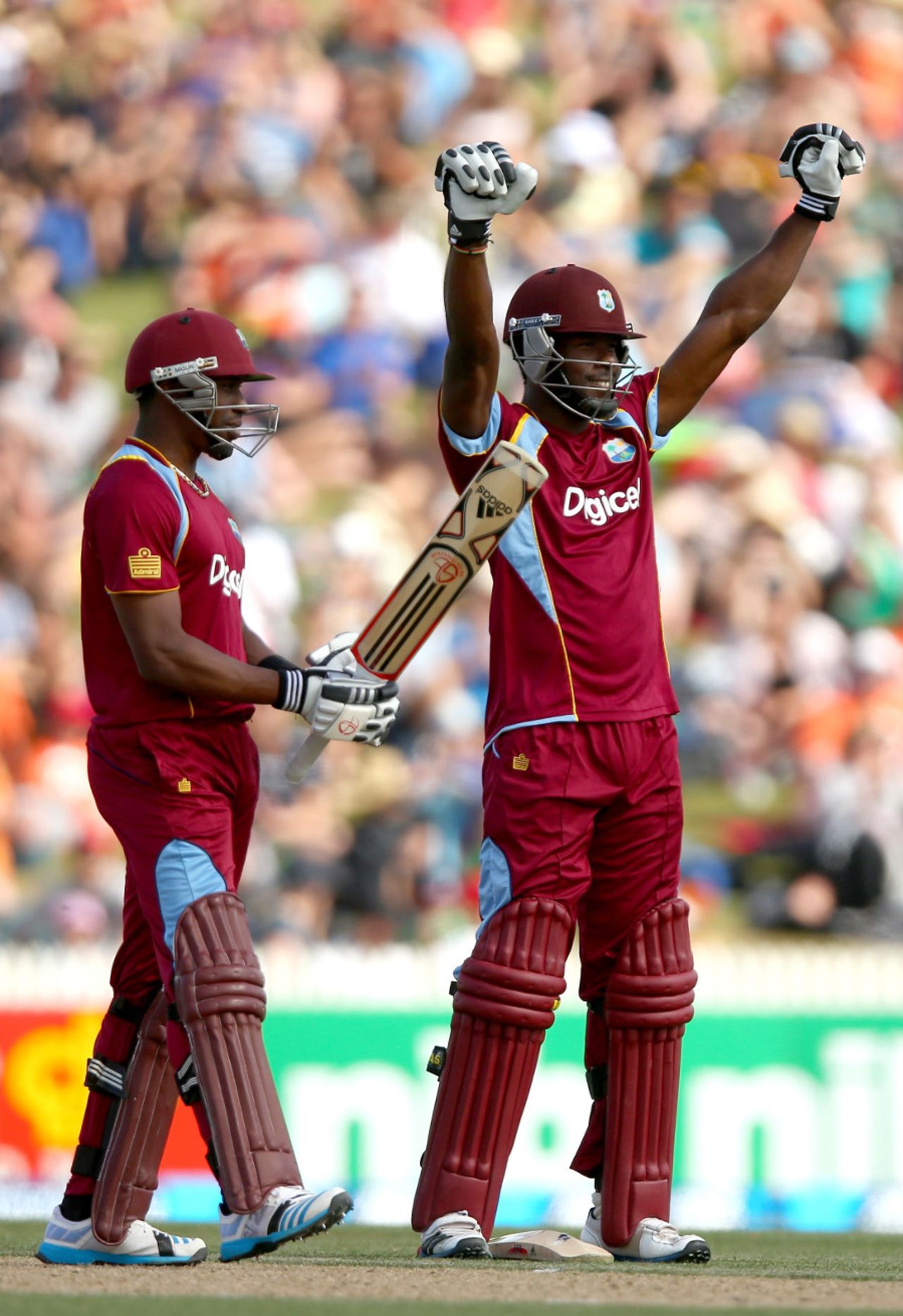 Kirk Edwards raises his arms - but not his bat - after reaching a hundred, New Zealand v West Indies, 5th ODI, Hamilton, January 8, 2013