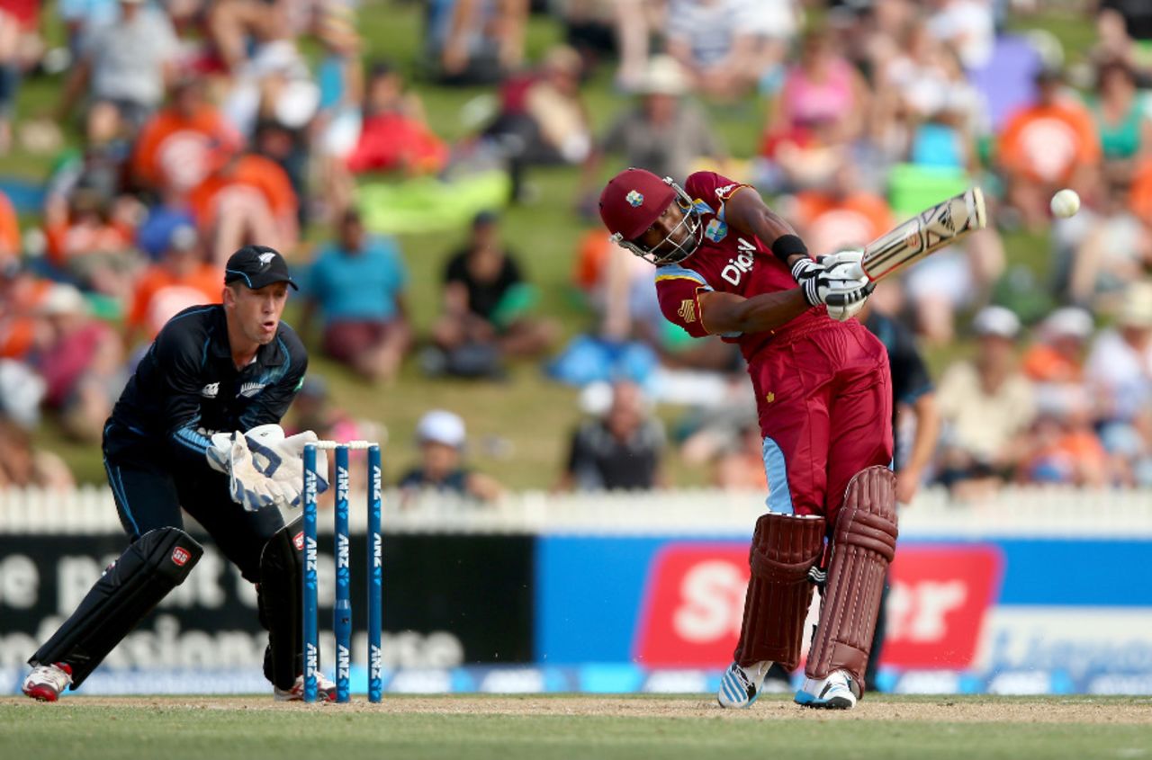 Dwayne Bravo launches another shot down the ground, New Zealand v West Indies, 5th ODI, Hamilton, January 8, 2013