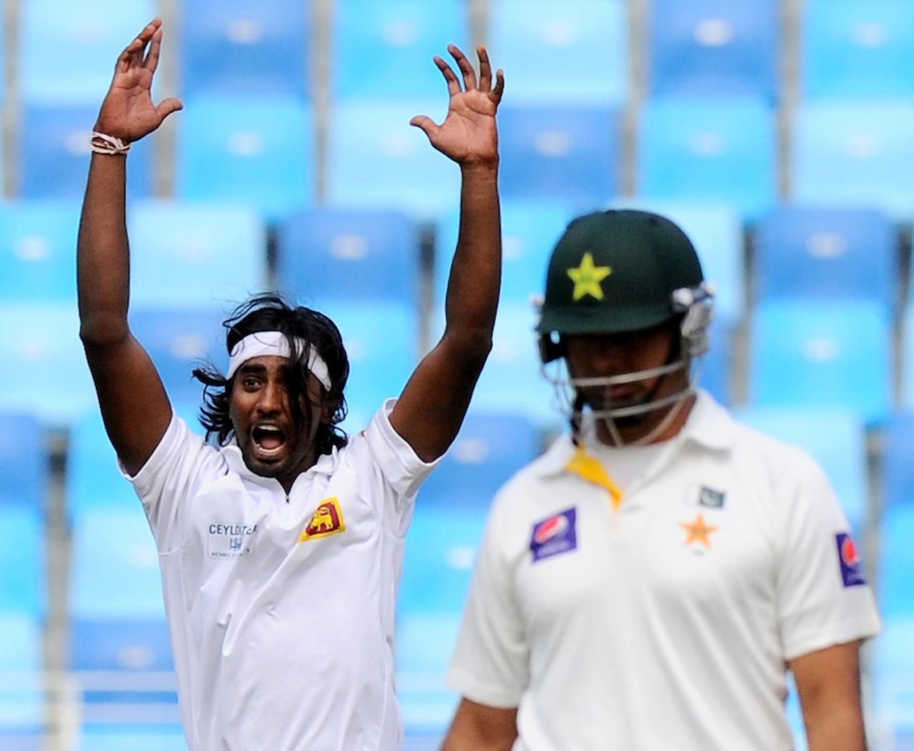 Nuwan Pradeep appeals successfully for an lbw against Ahmed Shehzad, Pakistan v Sri Lanka, 2nd Test, Dubai, 1st day, January 8, 2014