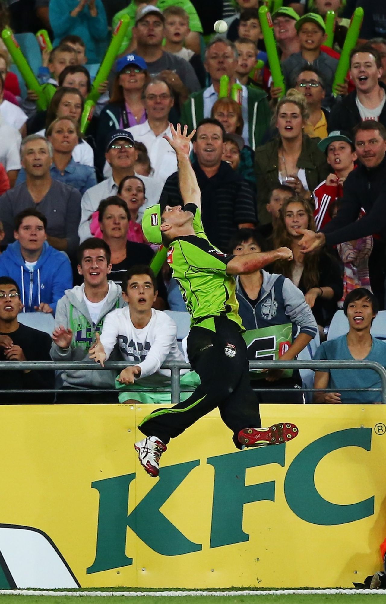 Cameron Borgas jumps in vain to catch the ball, Sydney Thunder v Brisbane Heat, Big Bash League, Sydney, January 8, 2014