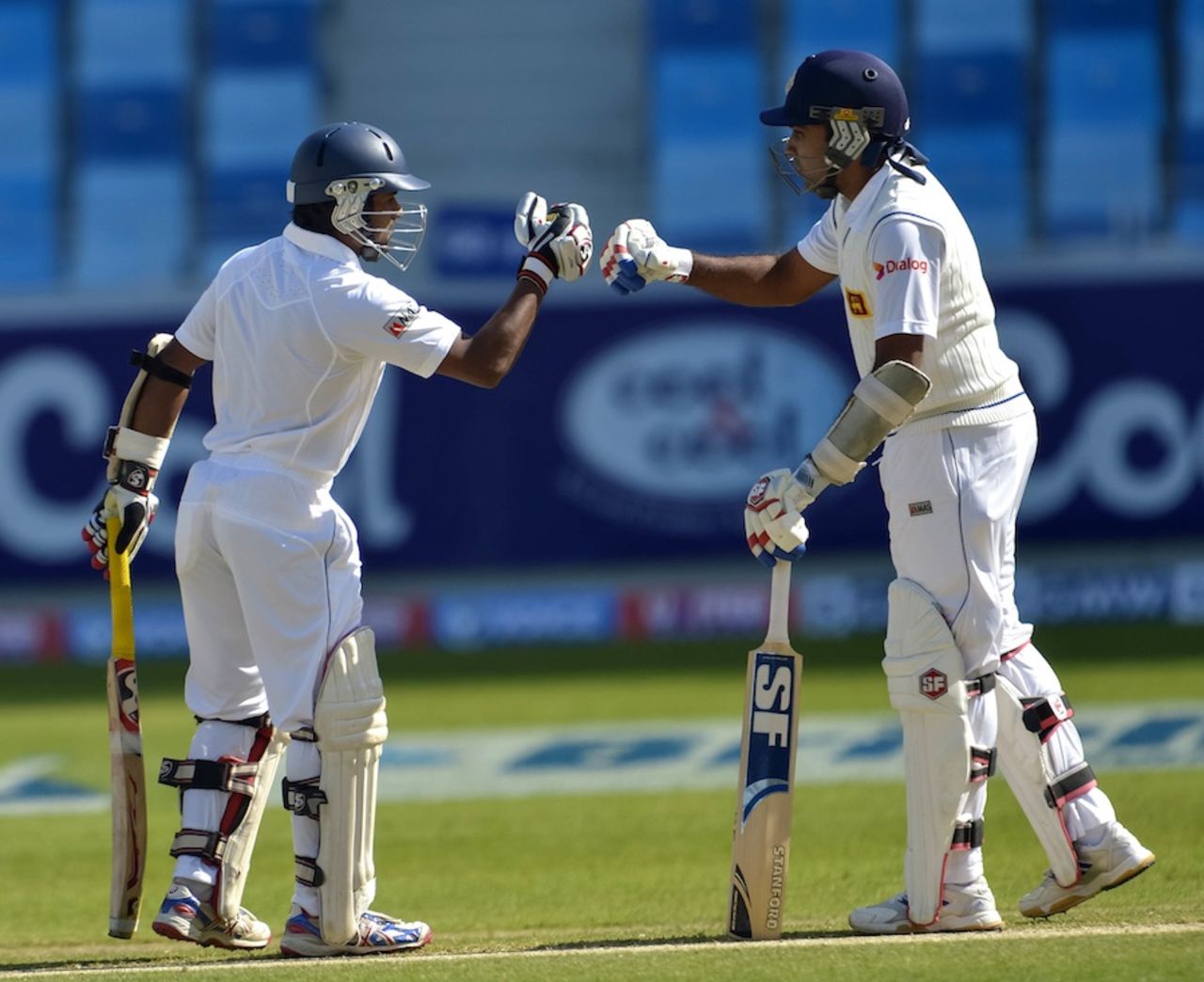 Kaushal Silva and Mahela Jayawardene punch gloves, Pakistan v Sri Lanka, 2nd Test, Dubai, 2nd day, January 9, 2014