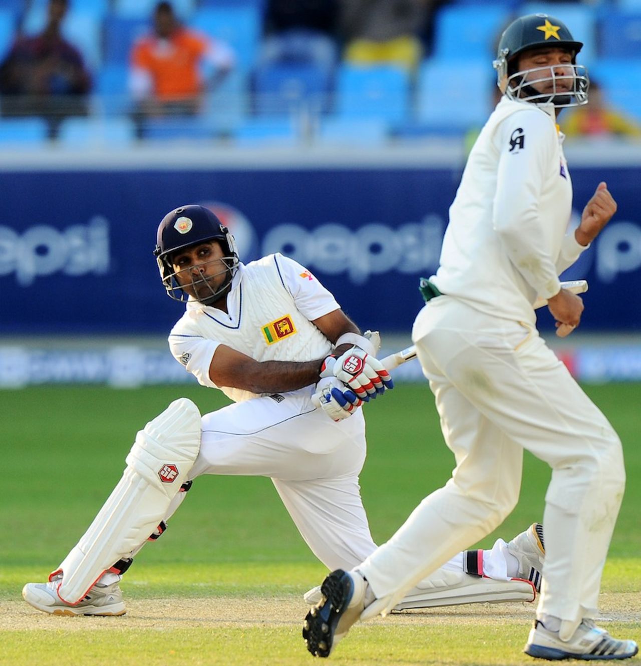 Mahela Jayawardene sends short leg hurrying for cover, Pakistan v Sri Lanka, 2nd Test, Dubai, 2nd day, January 9, 2014