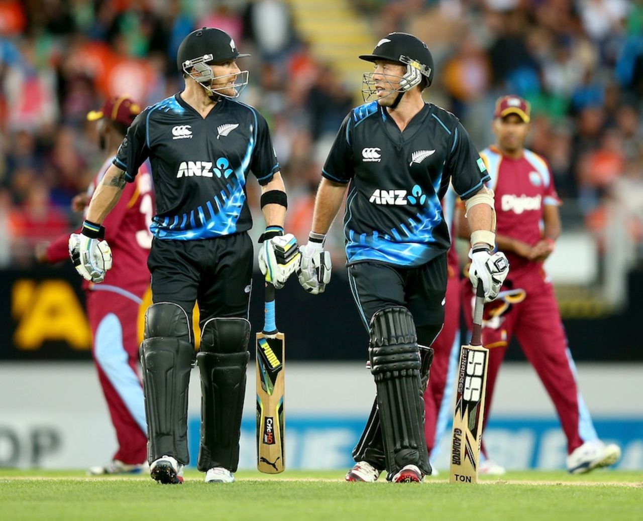 Brendon McCullum and Luke Ronchi walk back after their stand of 85, New Zealand v West Indies, 1st T20, Auckland, January 11, 2014